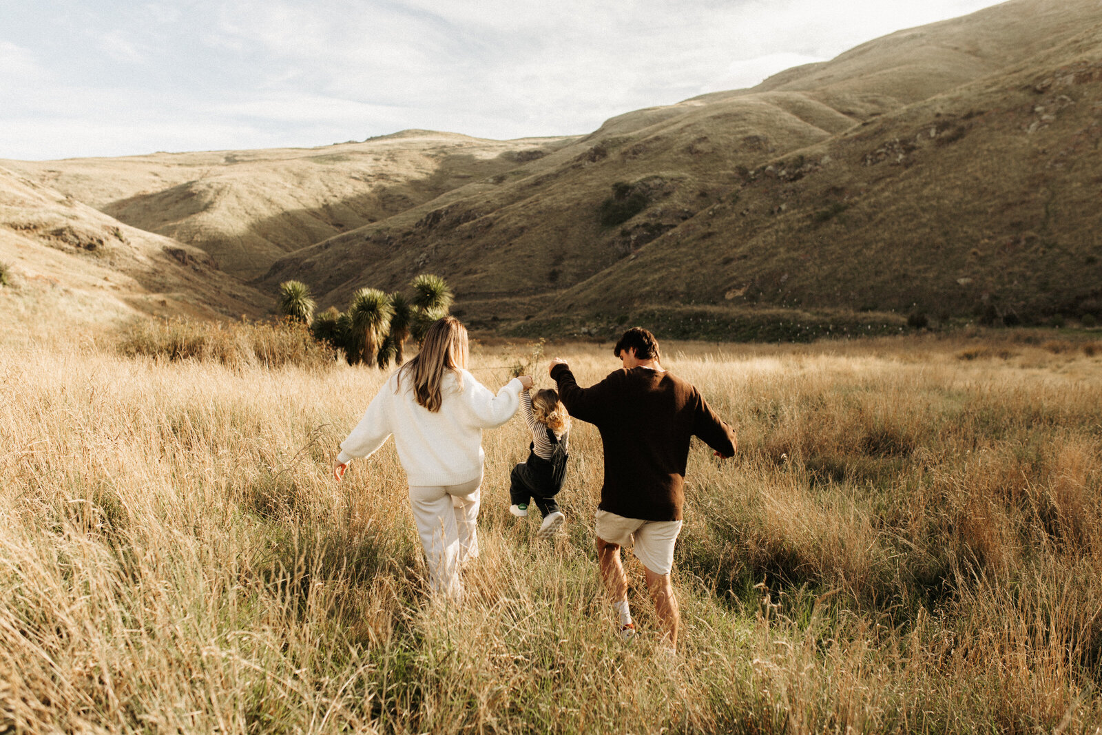 Motherhood family session in the tall grass at Taylors Mistake in Christchurch