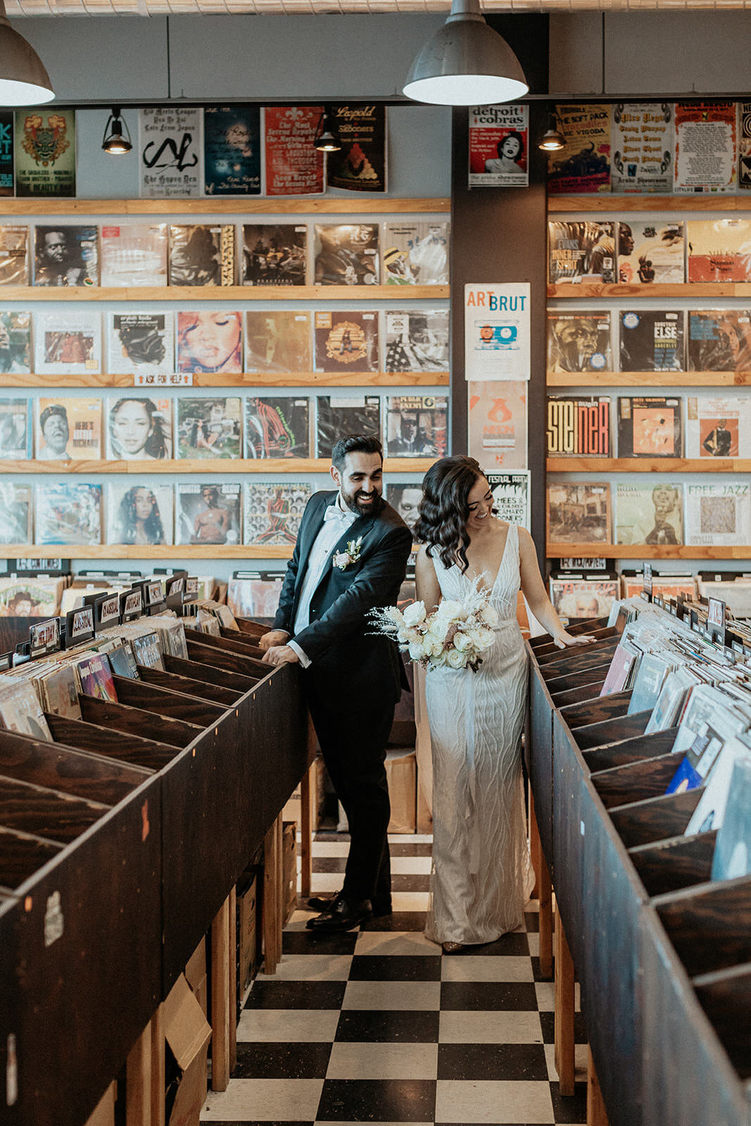 Bride and groom in a record store in Las Vegas