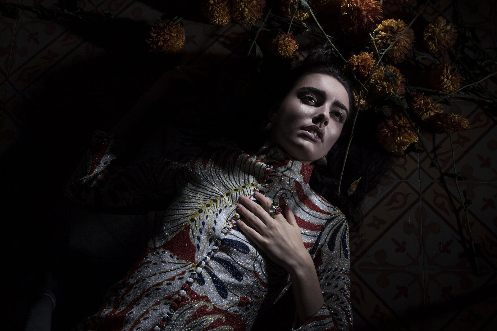 Makeup on model surrounded by flowers