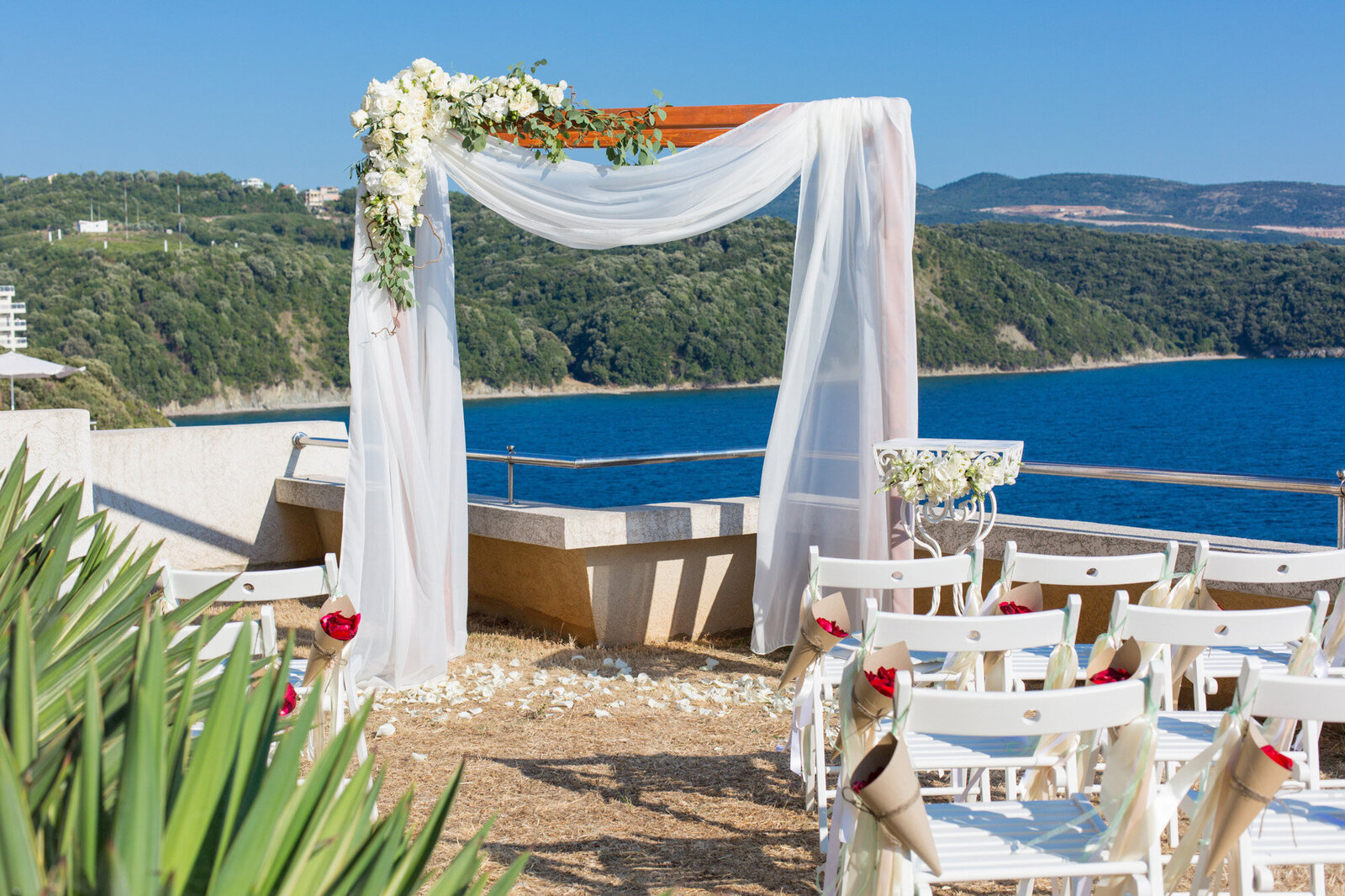 Beach wedding ceremony site with florals
