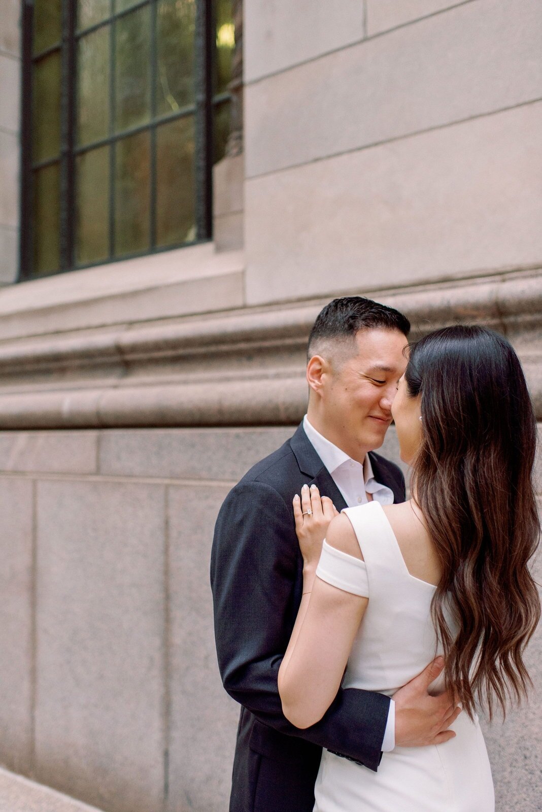 Modern Couple Embrace in Financial District Downtown Toronto Engagement Session Romantic Toronto Wedding Photographer Jacqueline James Photography