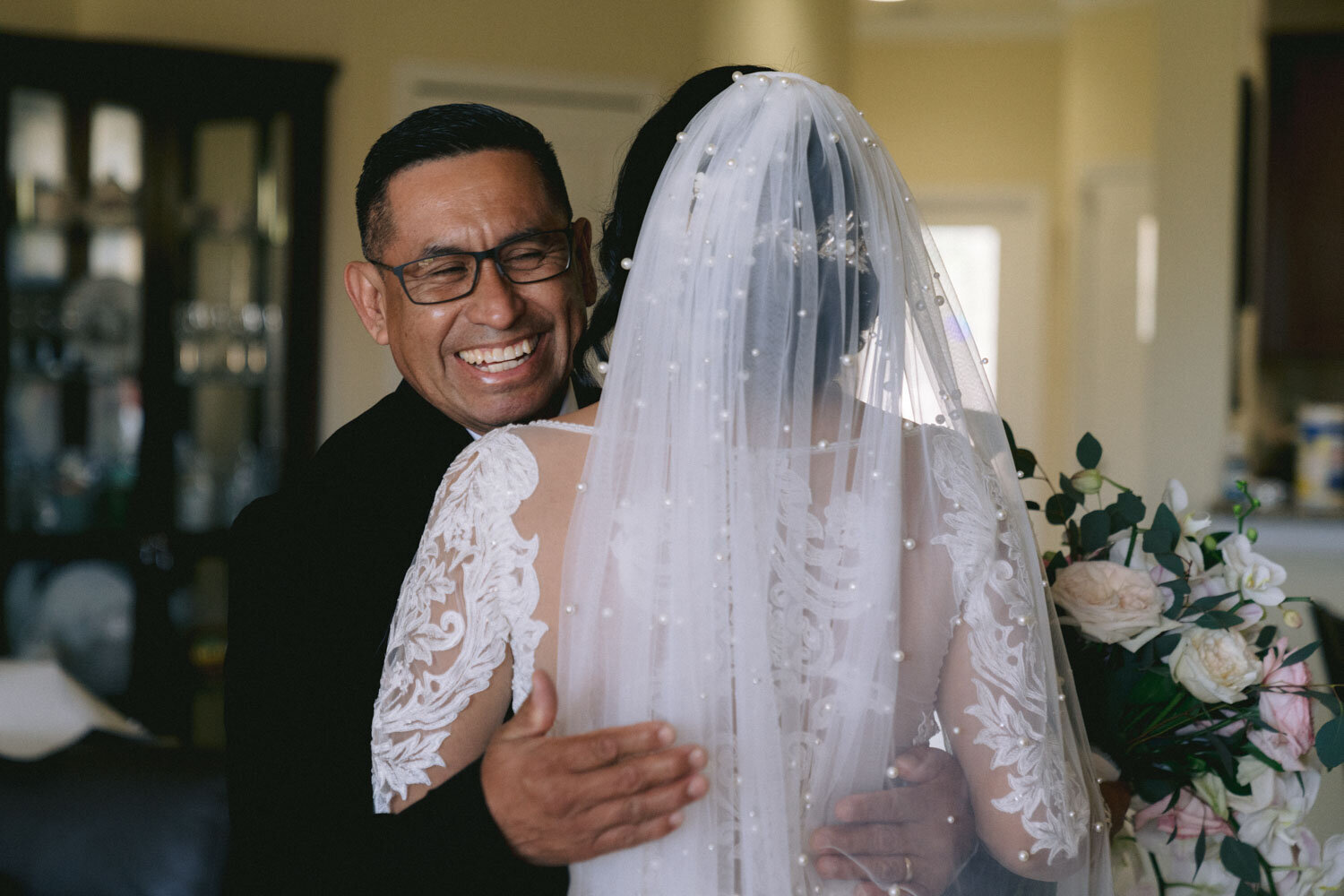 Bride hugged by her father