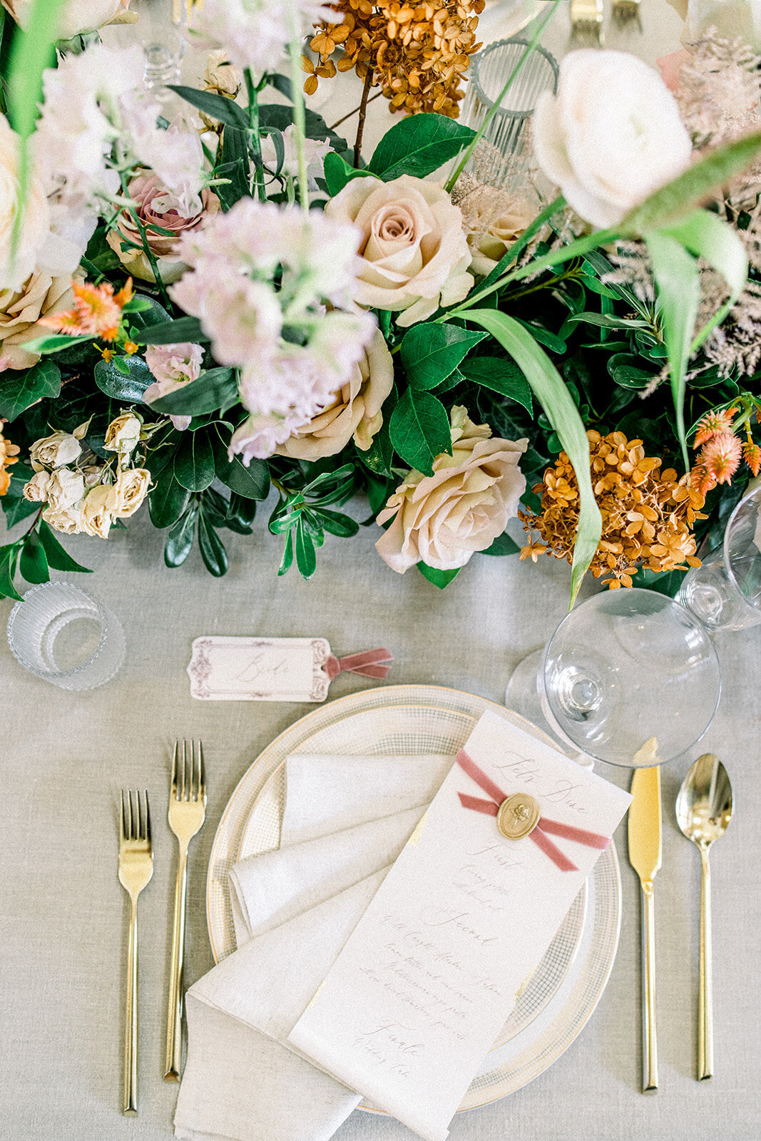 An elegantly decorated table setting at the wedding reception held at the luxurious Filoli venue in Woodside, California.