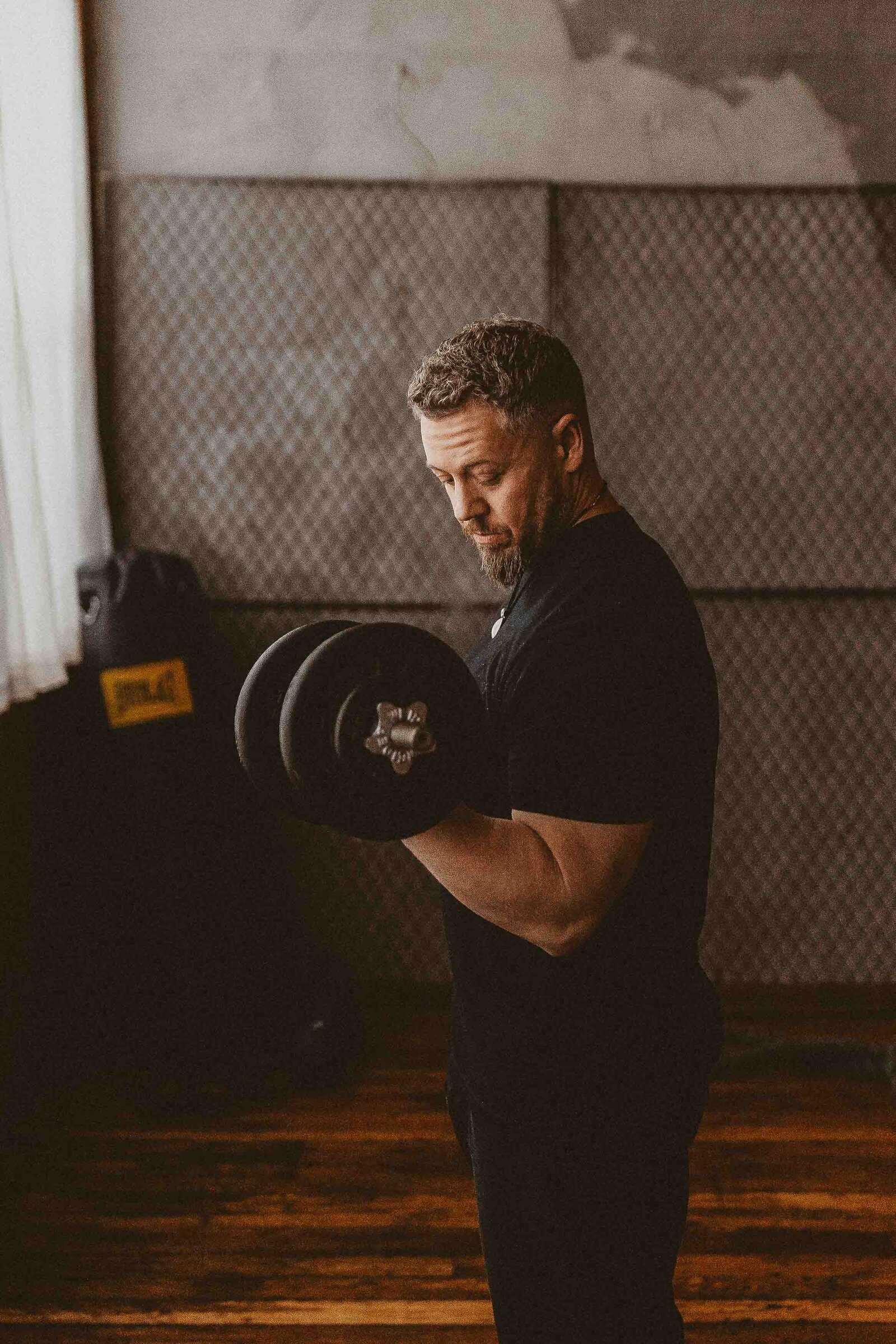 man lifting a dumbell