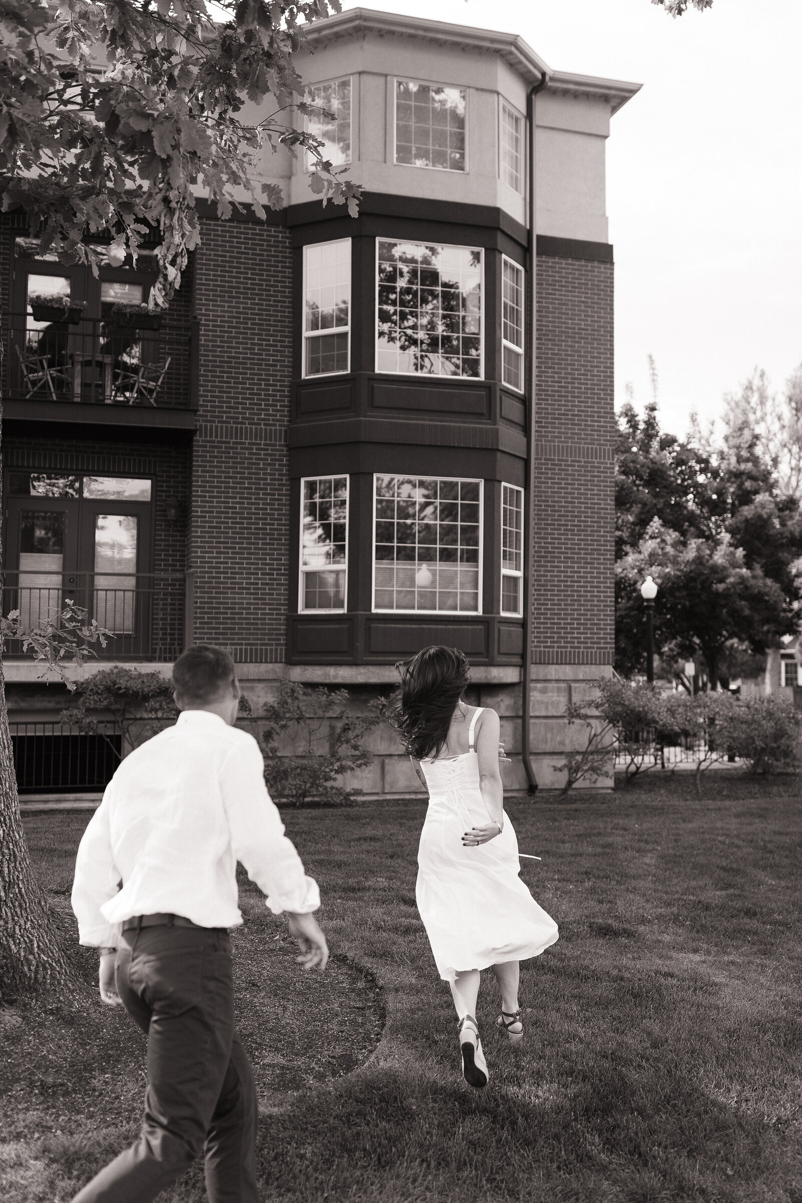 Couple laughing and chasing each other during playful Coeur d'Alene elopement photos
