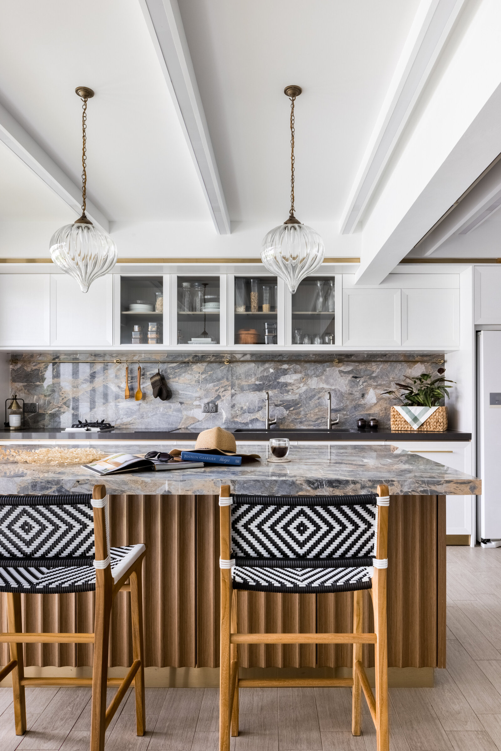 marble island counter top with two stools