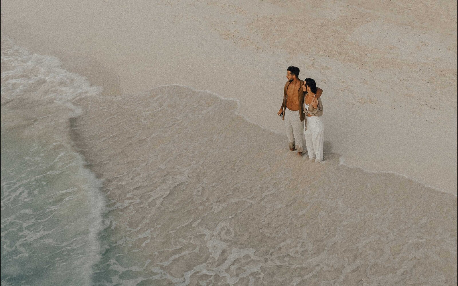 couple in tulum beach caribbean sea jungle luxe