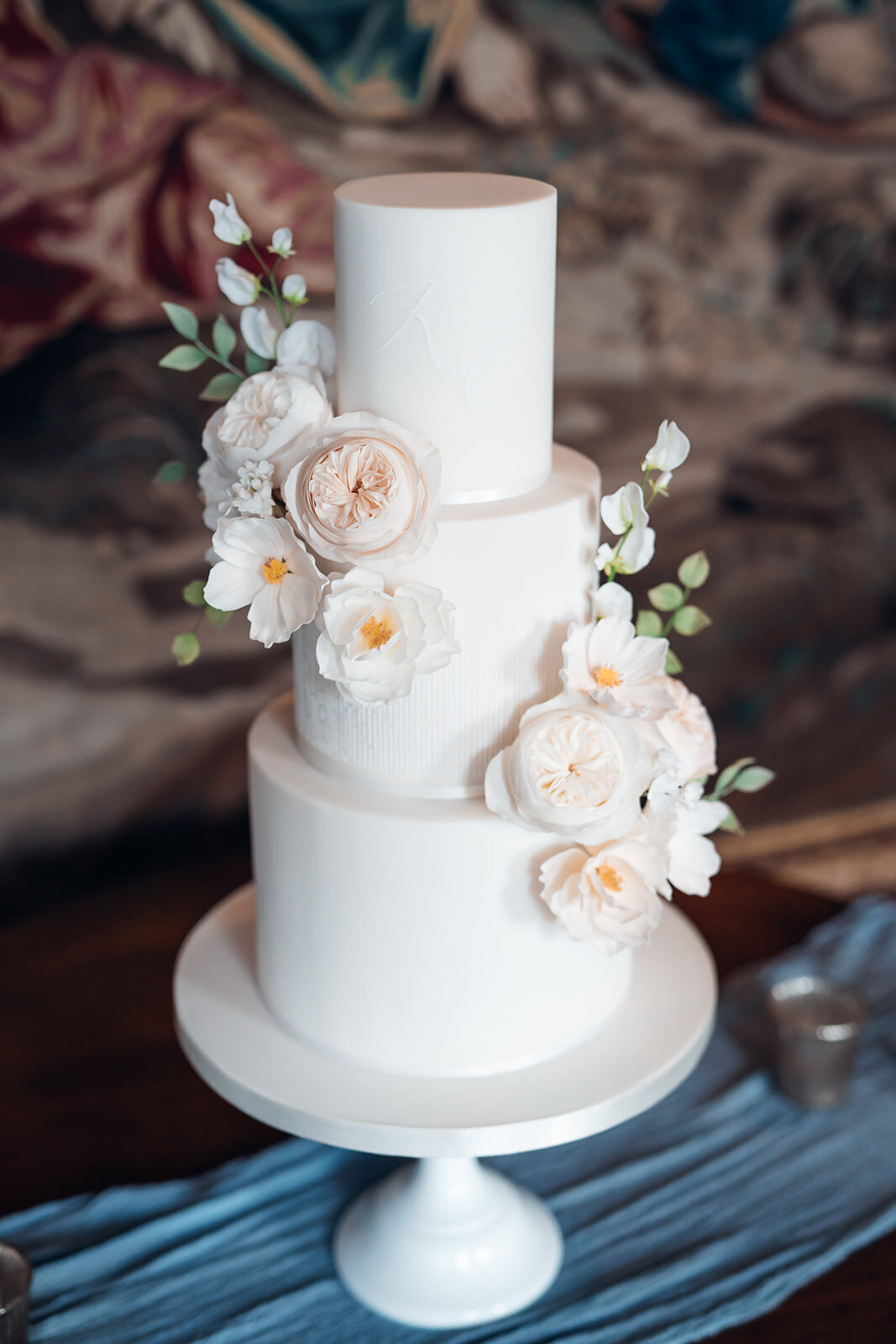 bespoke-wedding-cake-styled-with-pastel-blue