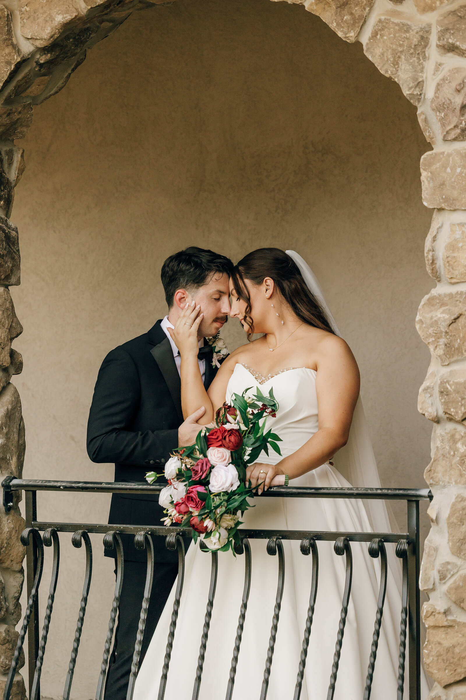 Bride and groom embracing one another at Stone Haven wedding venue in Section, AL