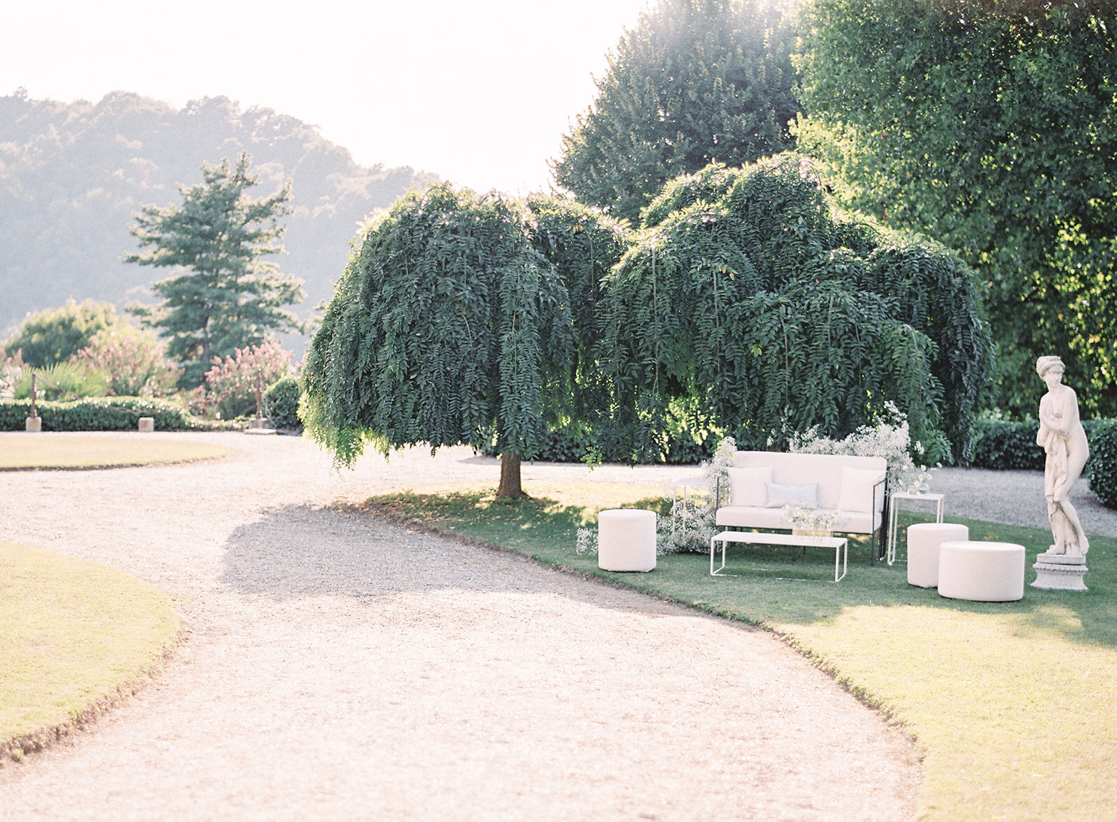 seating area at wedding reception in the front lawn of villa. Photographed by Italy wedding photographer Amy Mulder Photography.