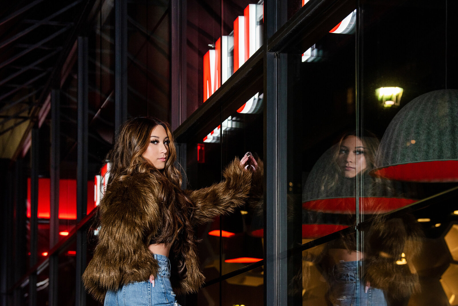 Champlin Minnesota  school senior photo of girl in fur jacket at night in downtown minneapolis