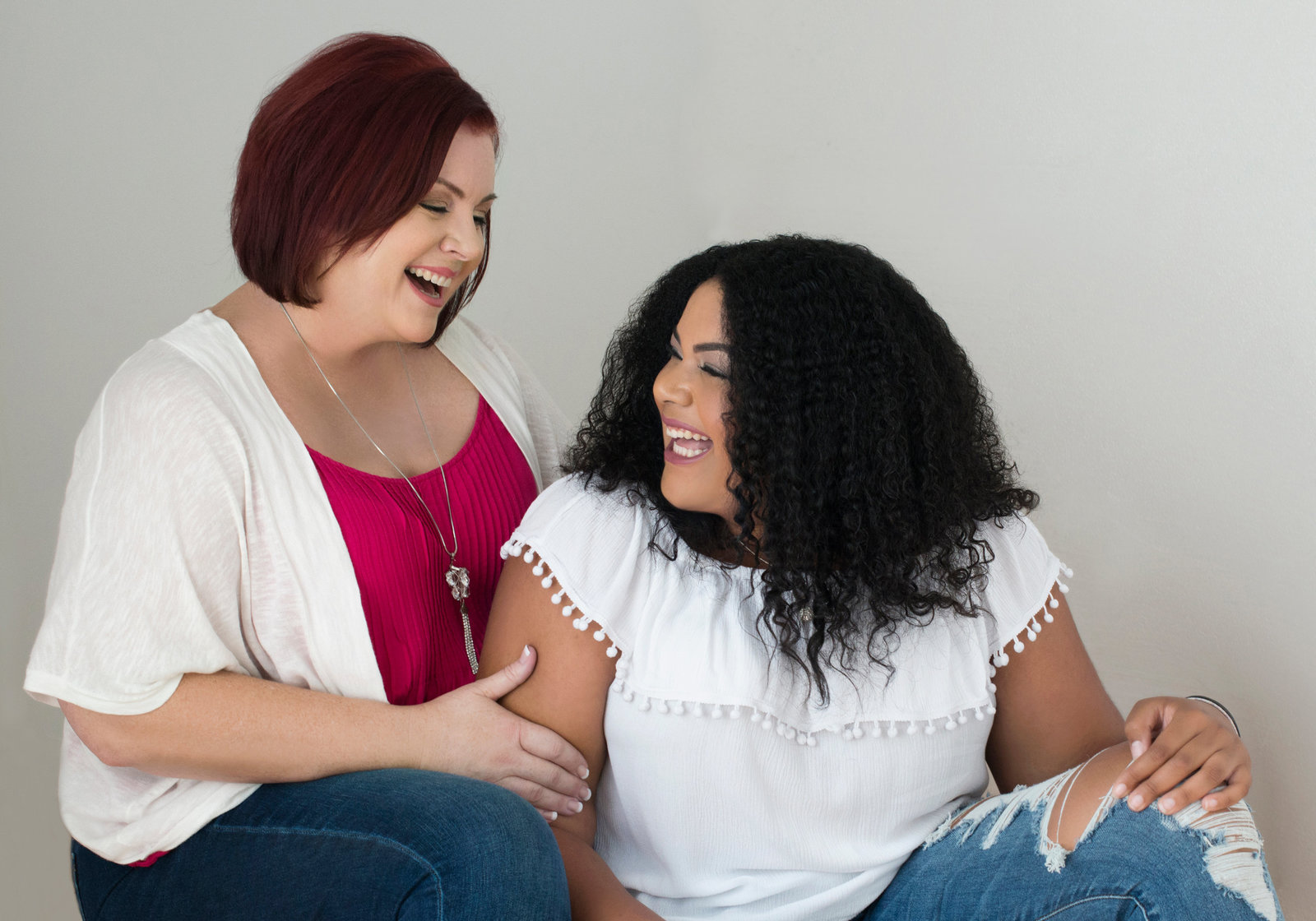 pERSONAL BRANDING PHOTOGRAPHER- OAKVILLE- Portrait  of  mother and  daughter looking at each other and  laughing . wearing white shirt and jeans