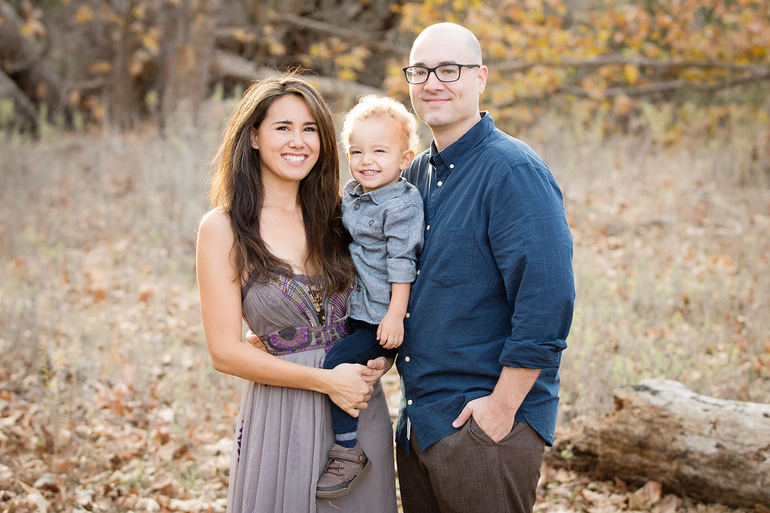 san diego family photographer | family in a field with leafs and fall colors