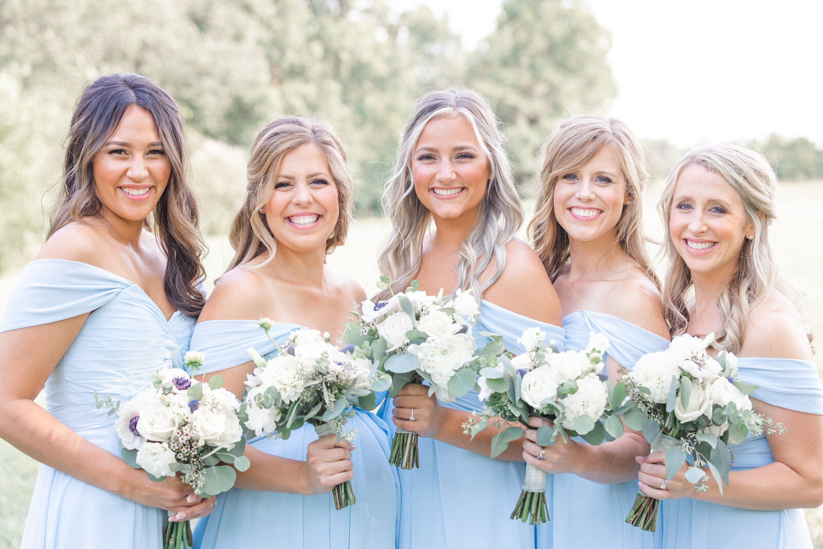 bright light and airy wedding photo of bridesmaids