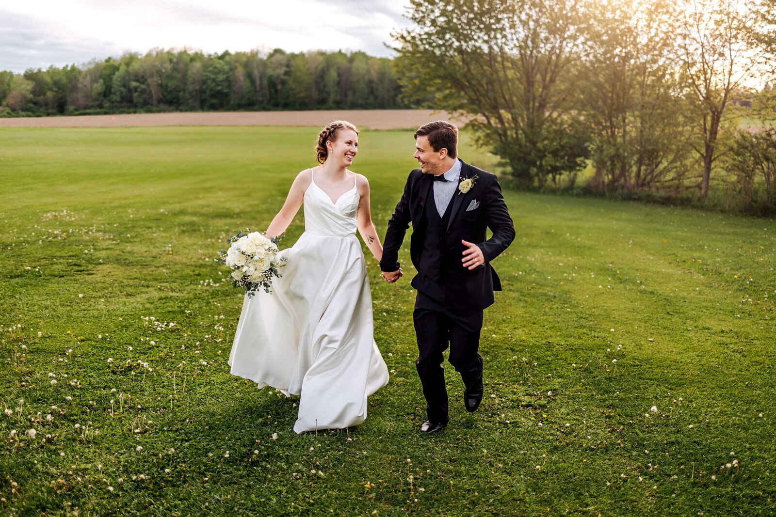 Newly wed couple runs hand in hand at Nick's Place in Edinboro, PA