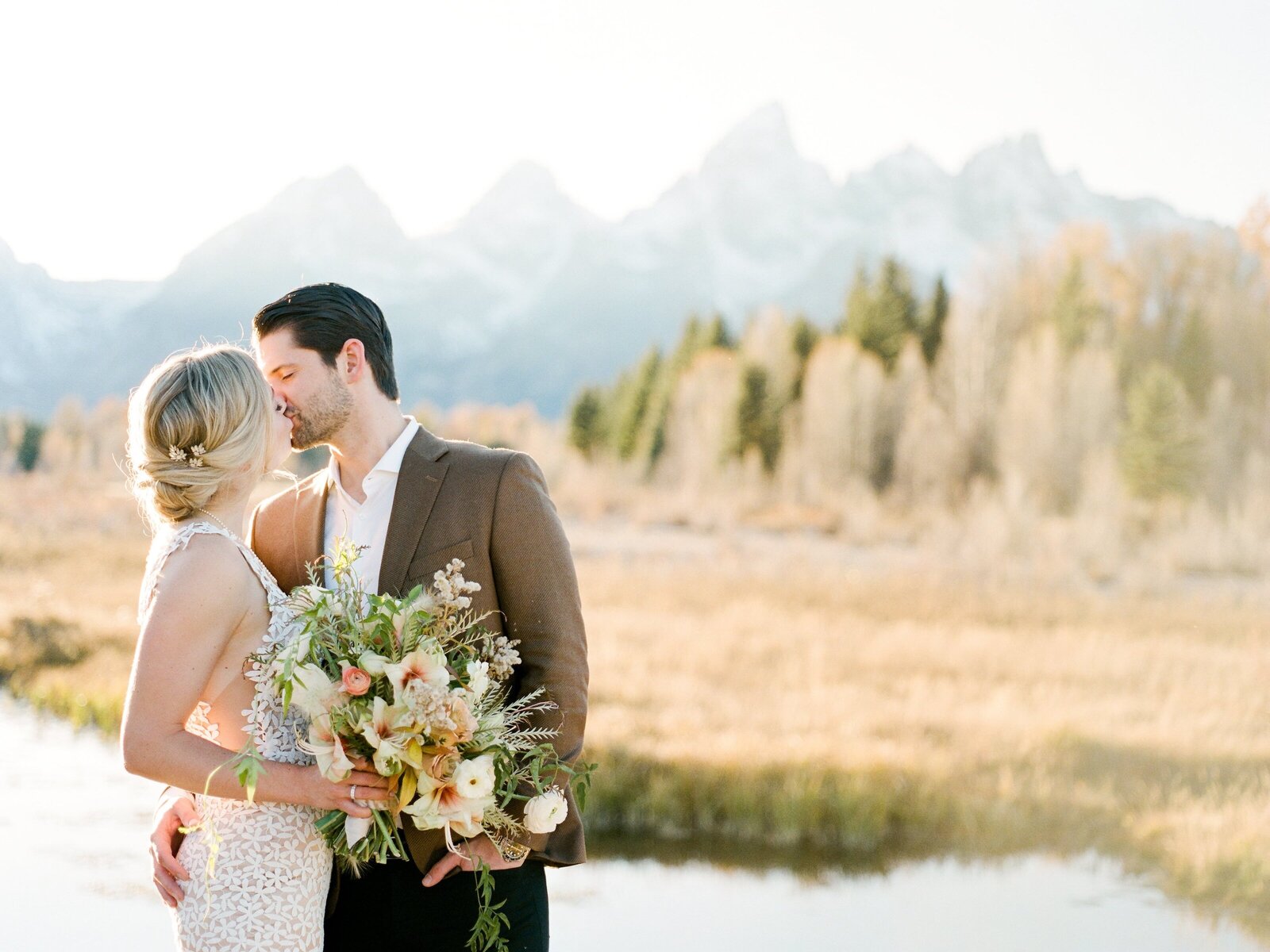 bridge and groom kissing