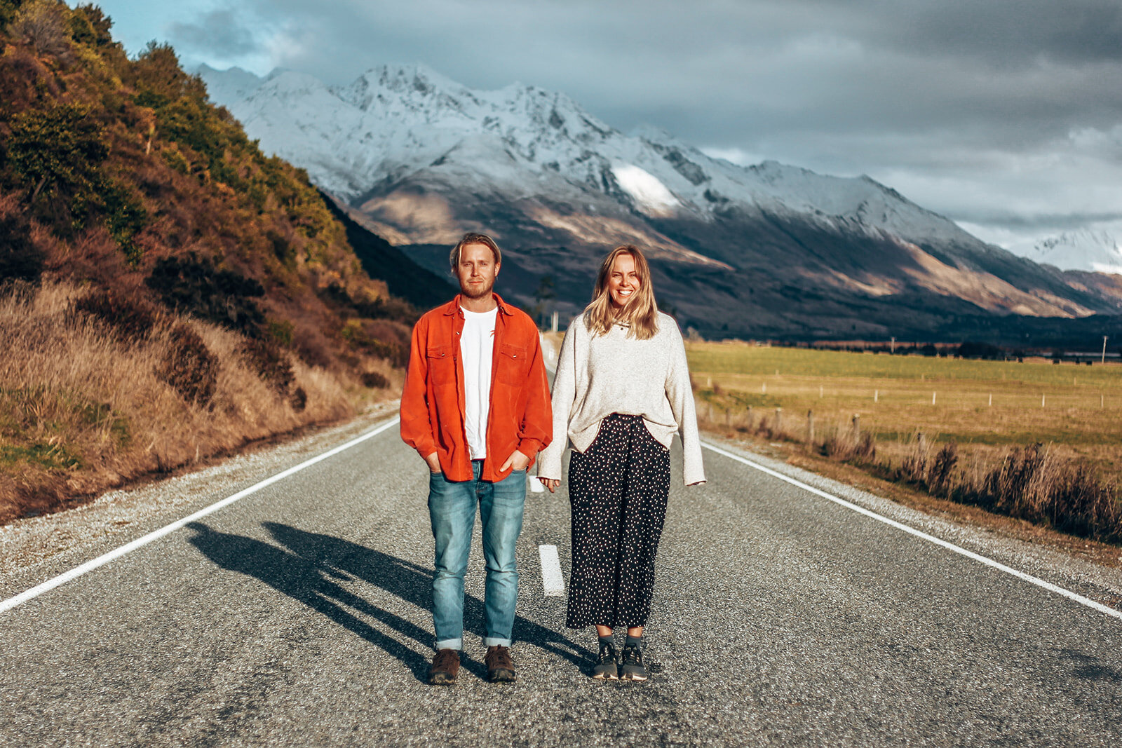 couple pose in front of mountains