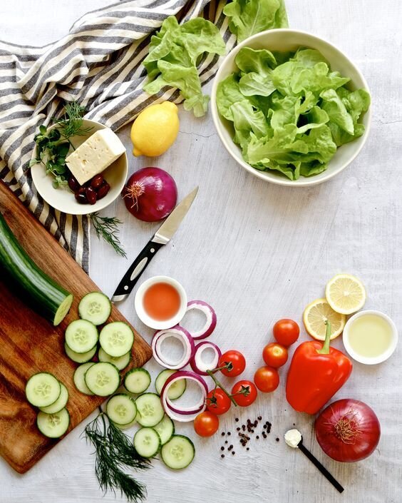 Greek salad ingredients styled food photography by Chelsea Loren branding food photographer in San Diego.