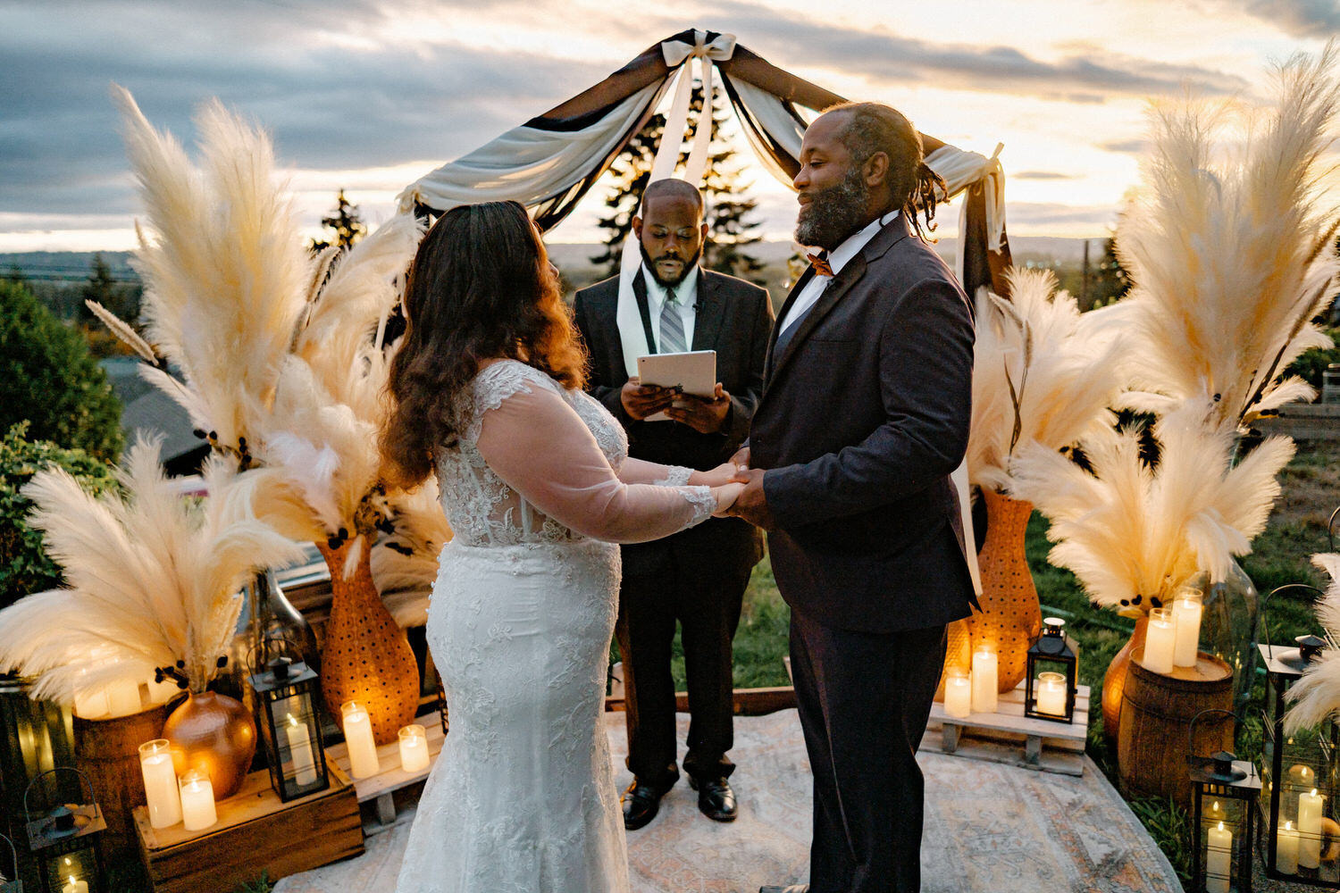 Bride and groom in backyard wedding ceremony.