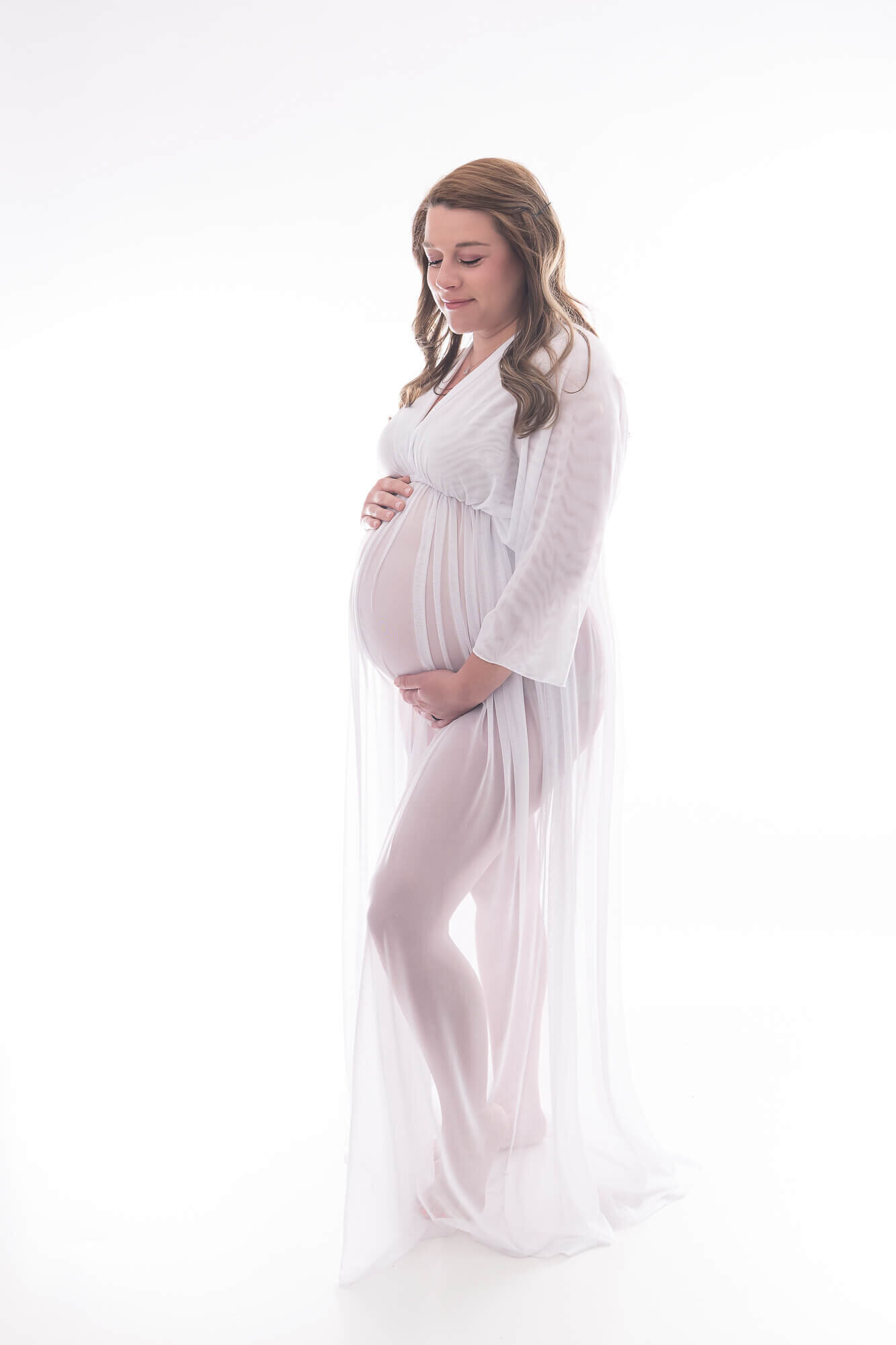 studio maternity session, mom in white maternity gown