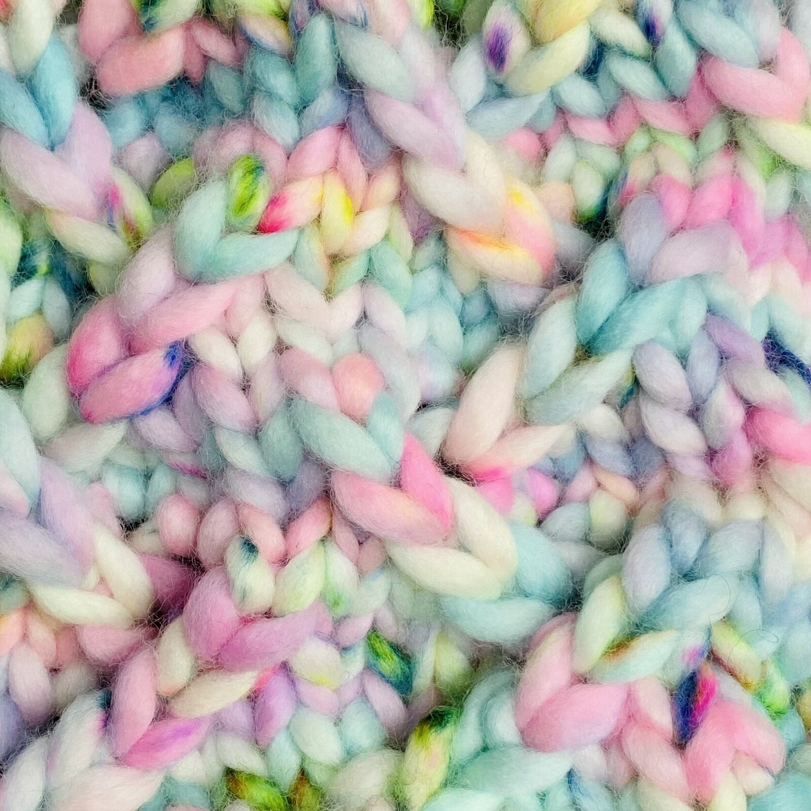 Up close of colorful yarn knit into pattern