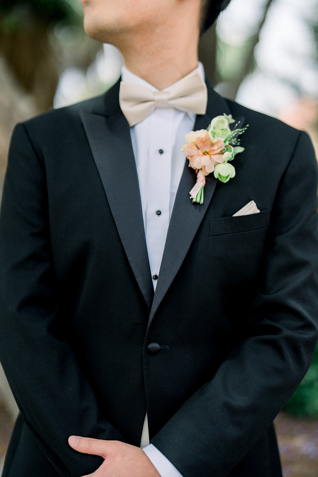 A close-up of the groom’s elegant boutonniere, adding a touch of sophistication to the Stanford University wedding ceremony.