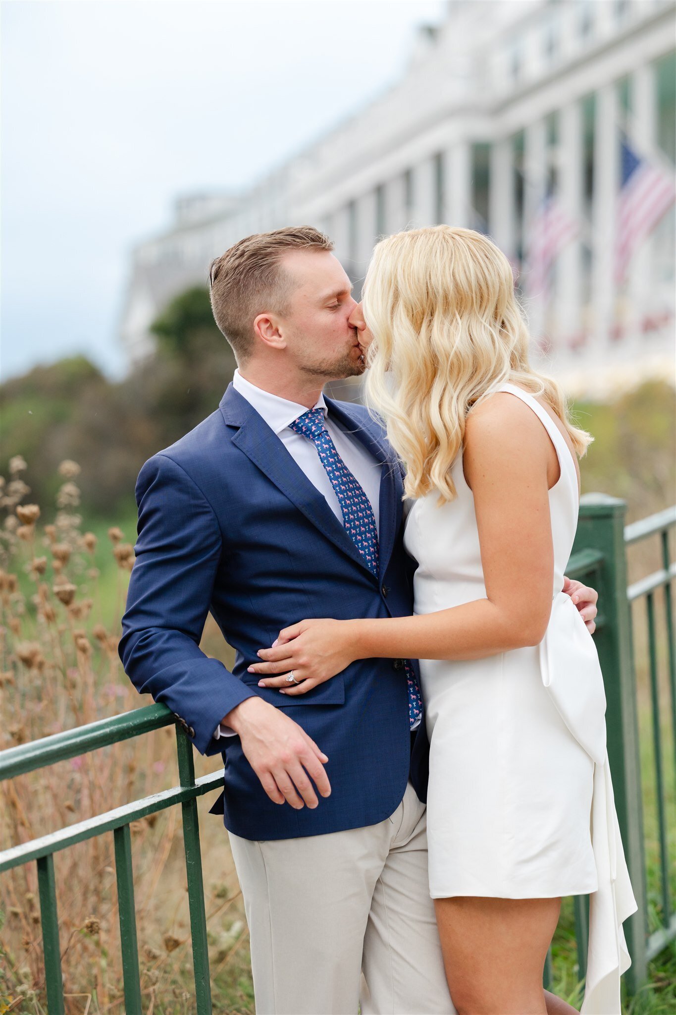 Couple kissing at the Grand Hotel on Mackinac Island, the night before their wedding