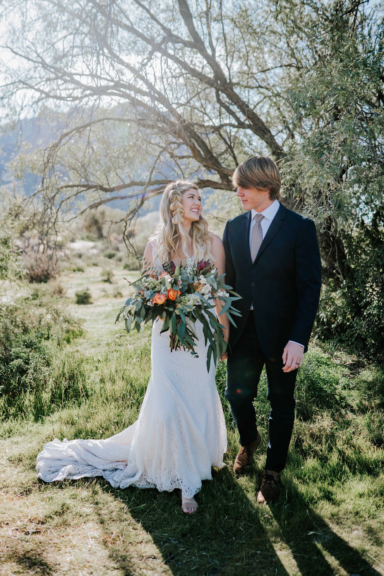 bride and groom looking at each other by tree in Chattanooga Tennessee