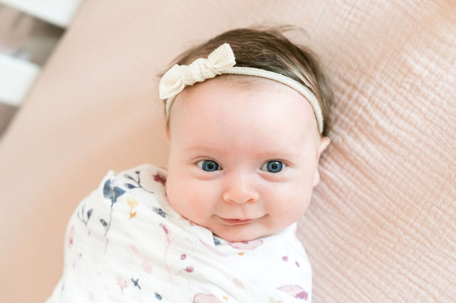 baby smiles in crib 