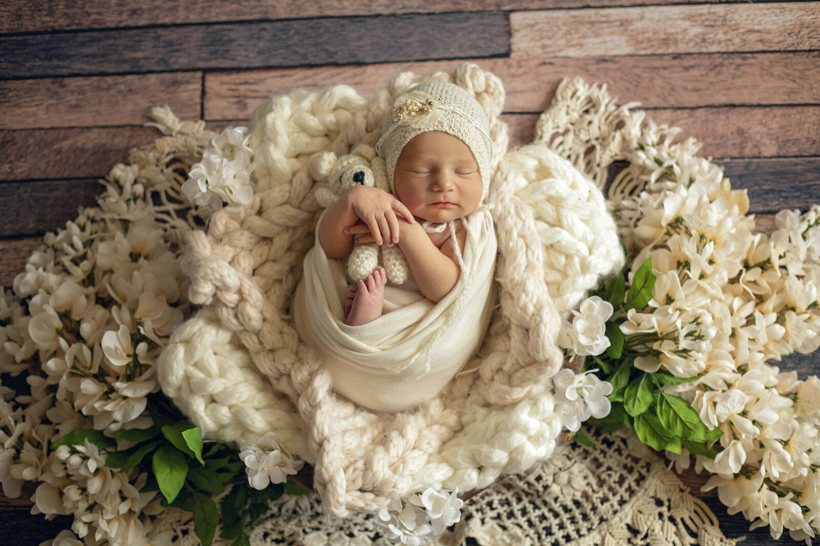 Newborn-photo-session-baby-girl-with-lots-of-white-flowers