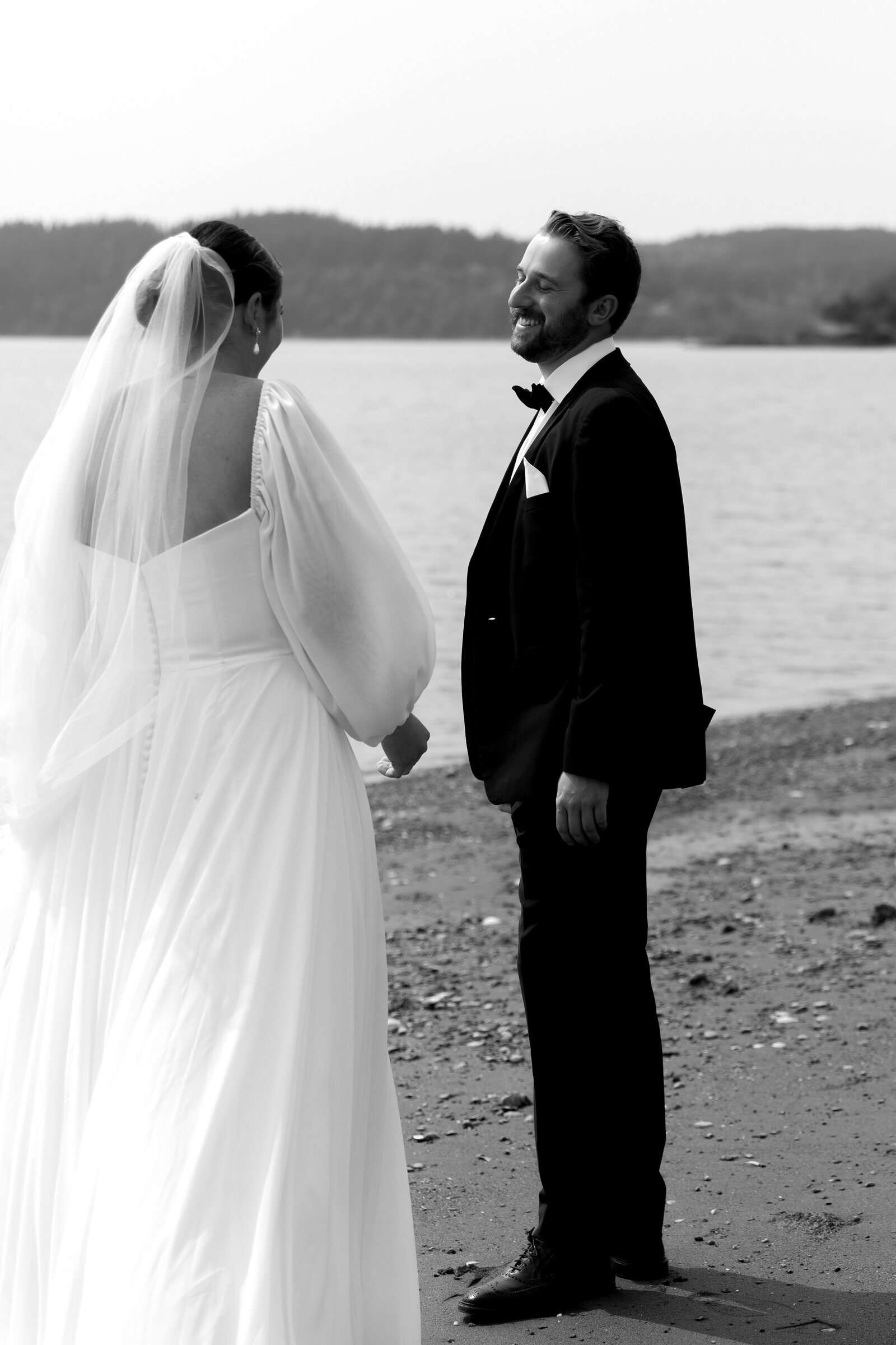 bride and groom on the beach during their first look