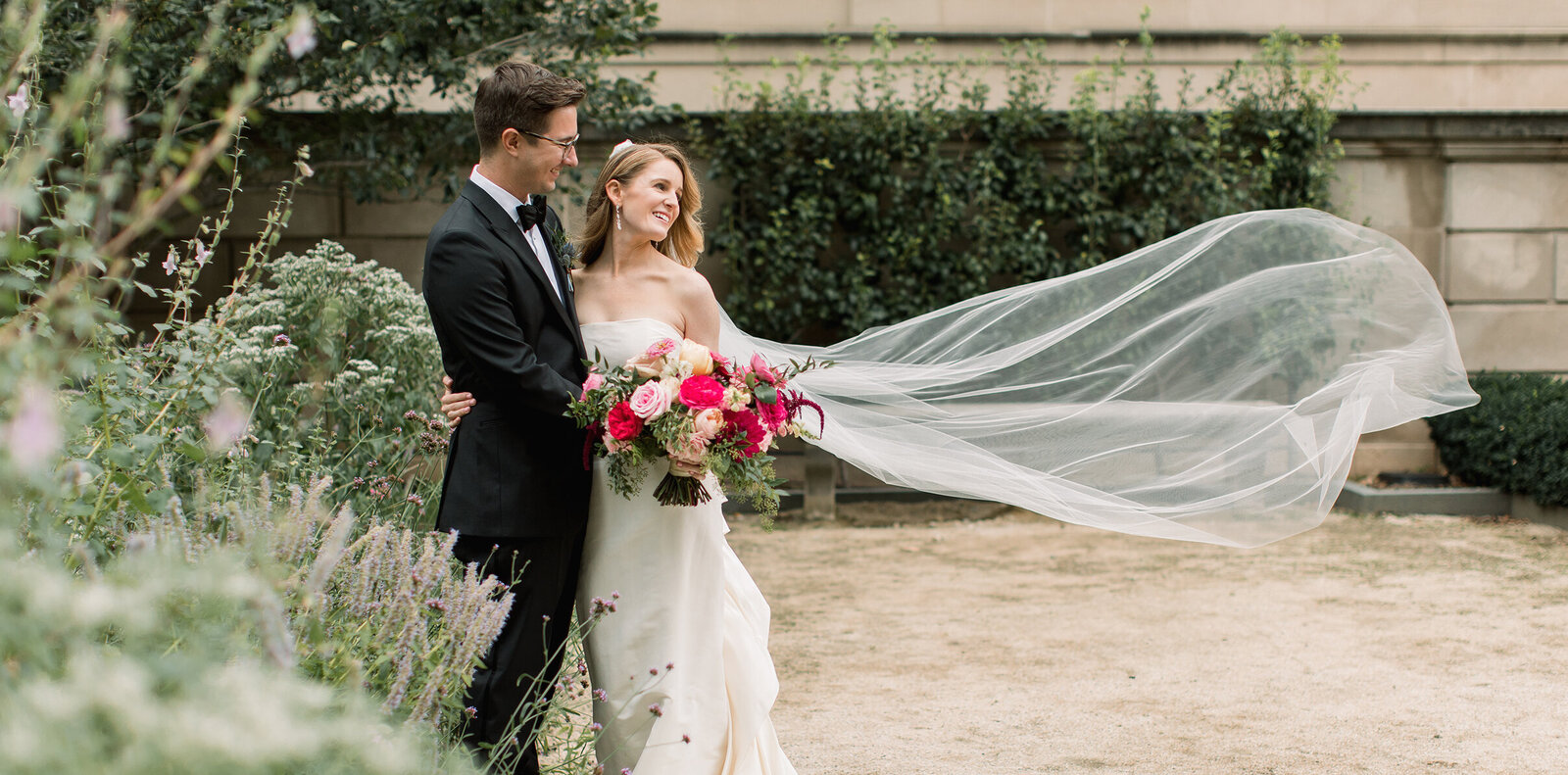 Brides veil caught in wind for her Philadelphia wedding photos