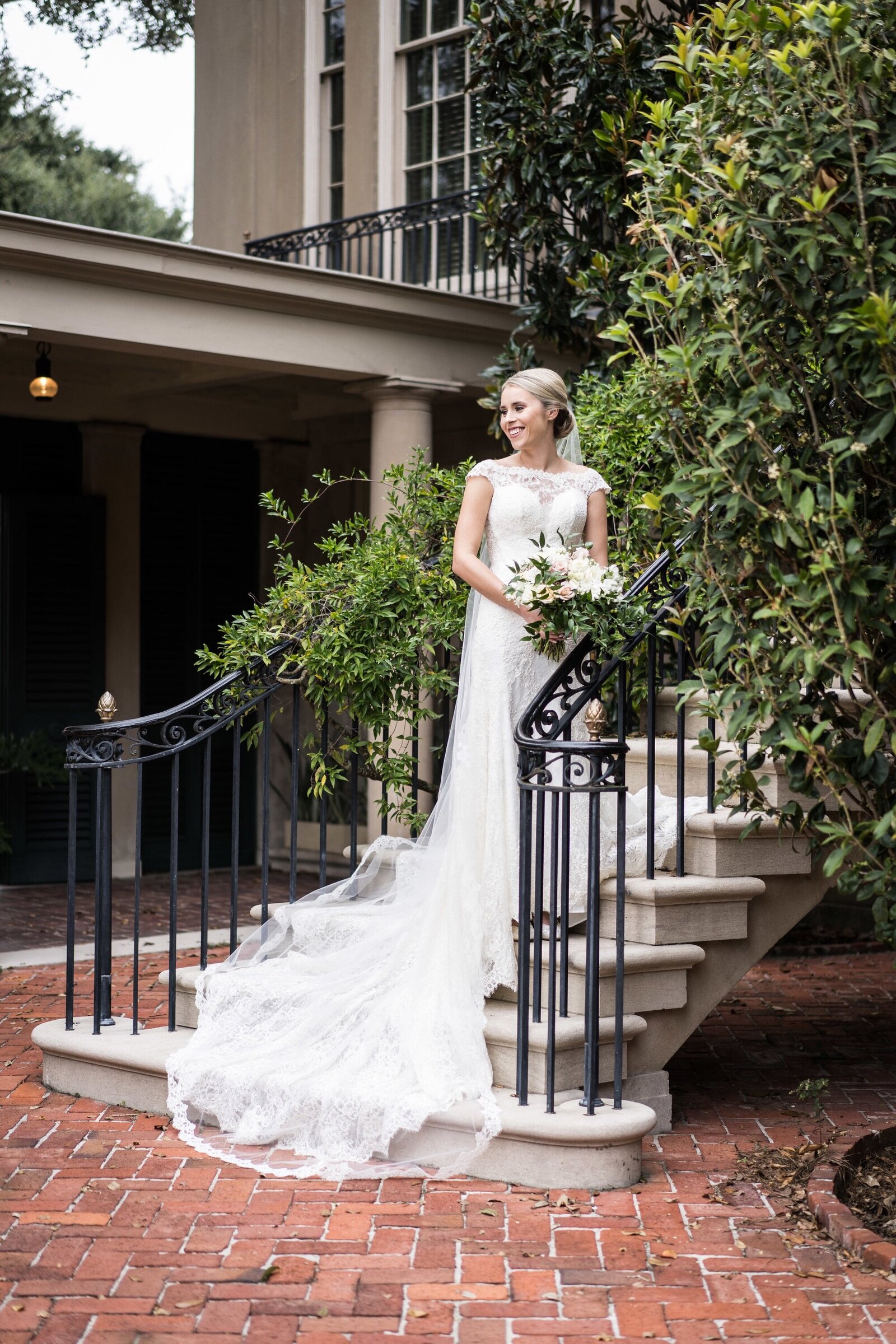 Bride on stairs at Longue Vue House and Gardens