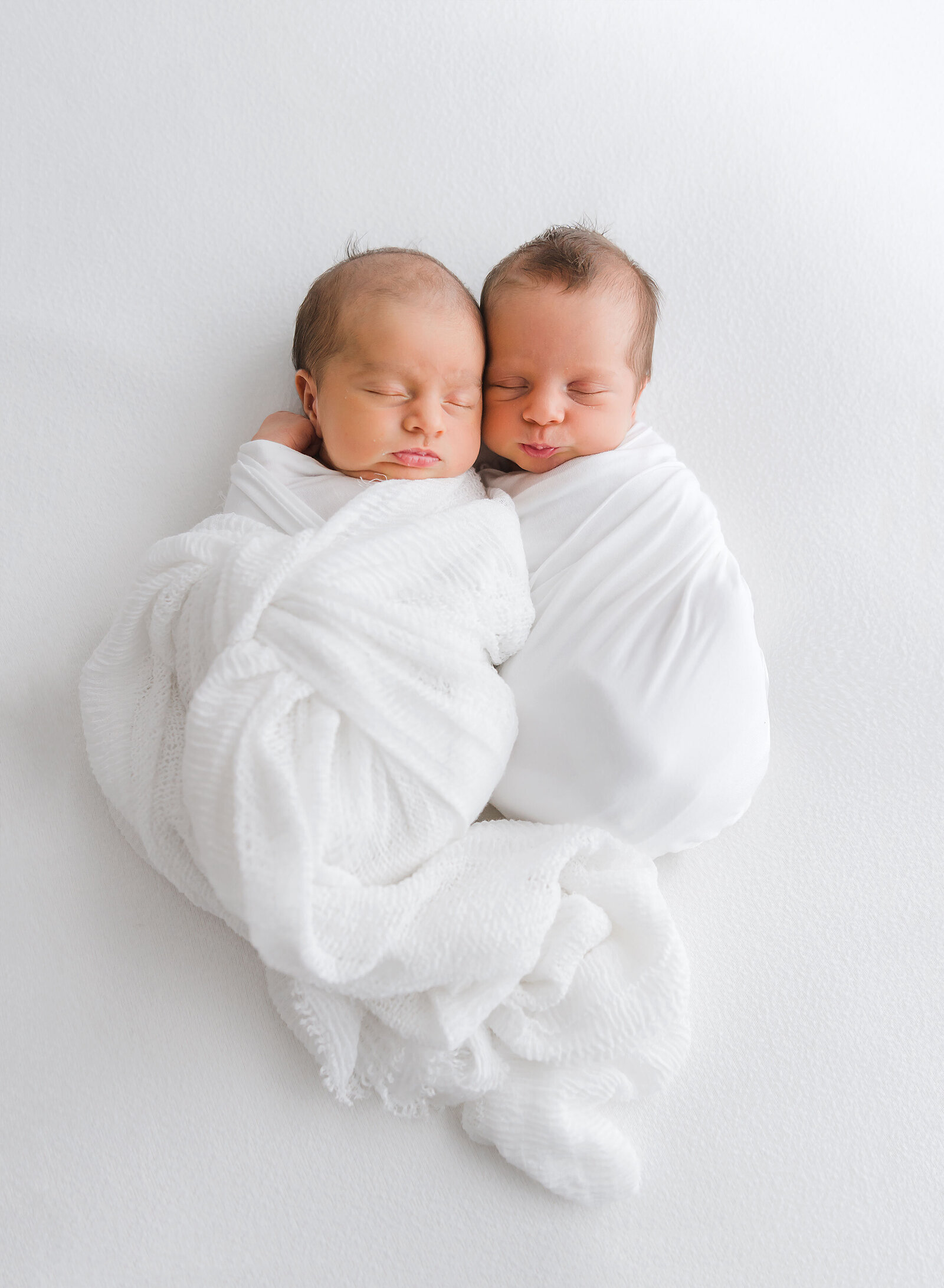 twins wrapped in white
