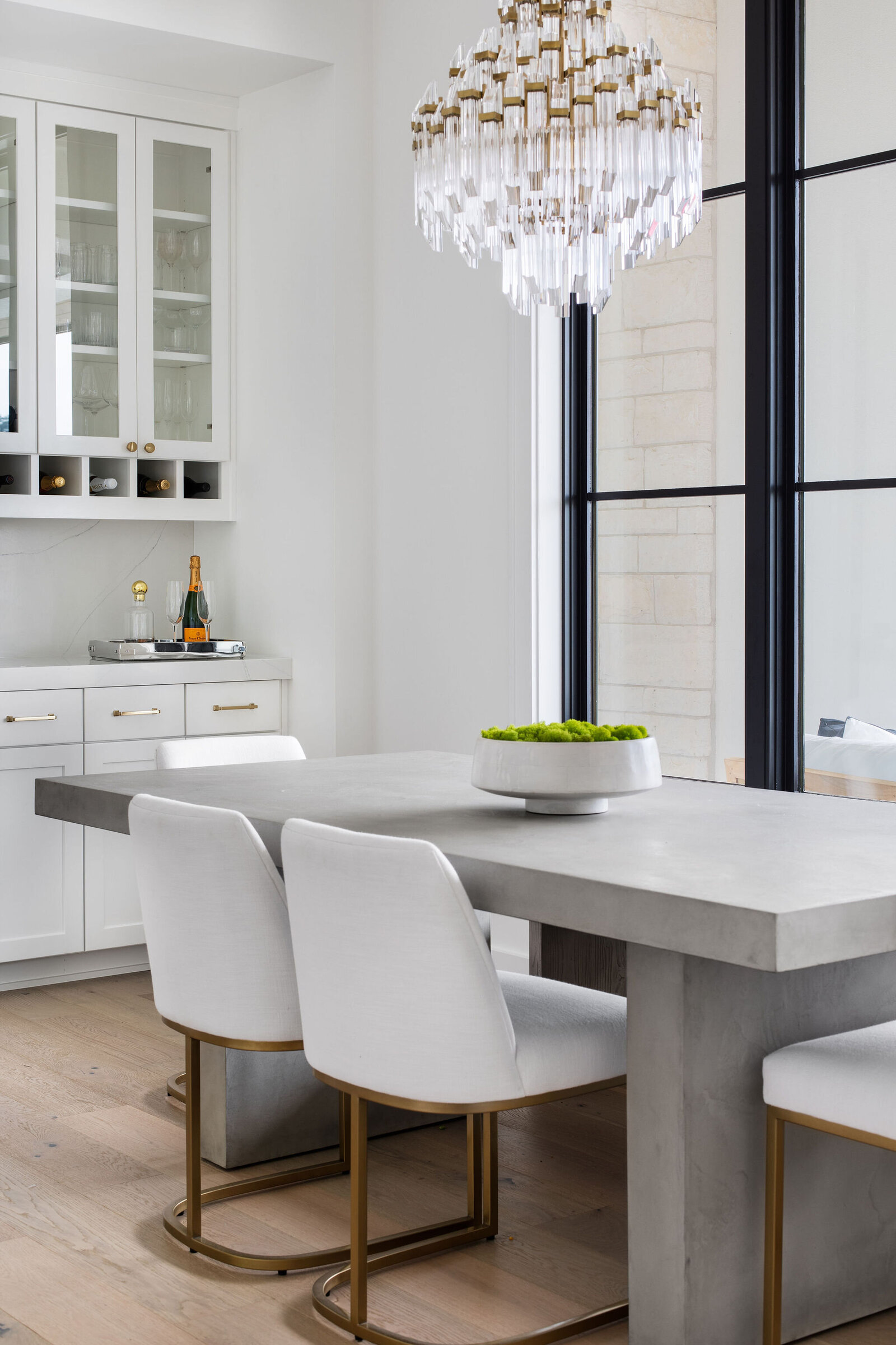 white+dining+concrete+table+chandelier+nuela+designs