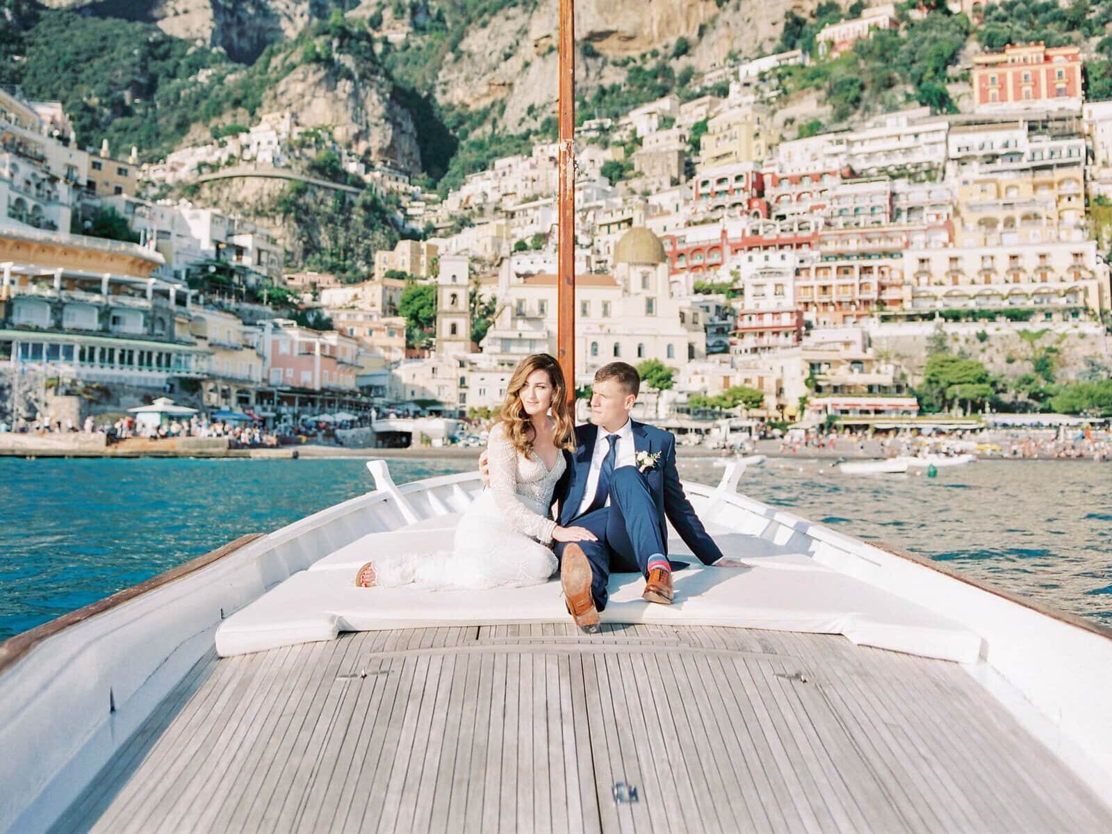 Bride and groom wedding day boat ride in positano