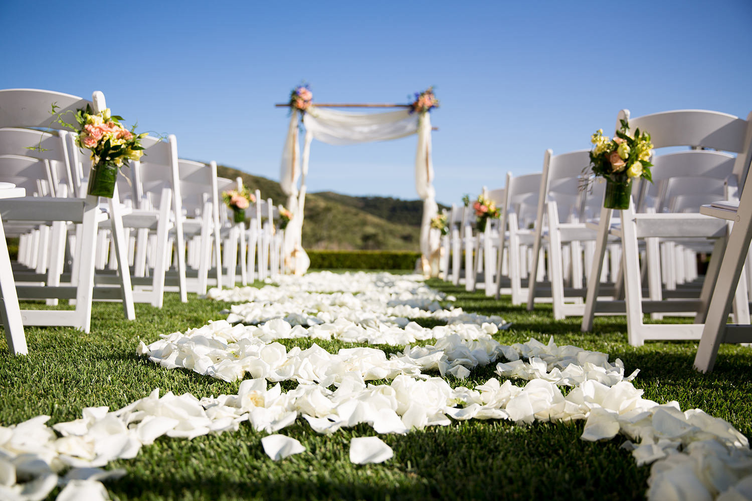 ceremony space with white and peace flowers