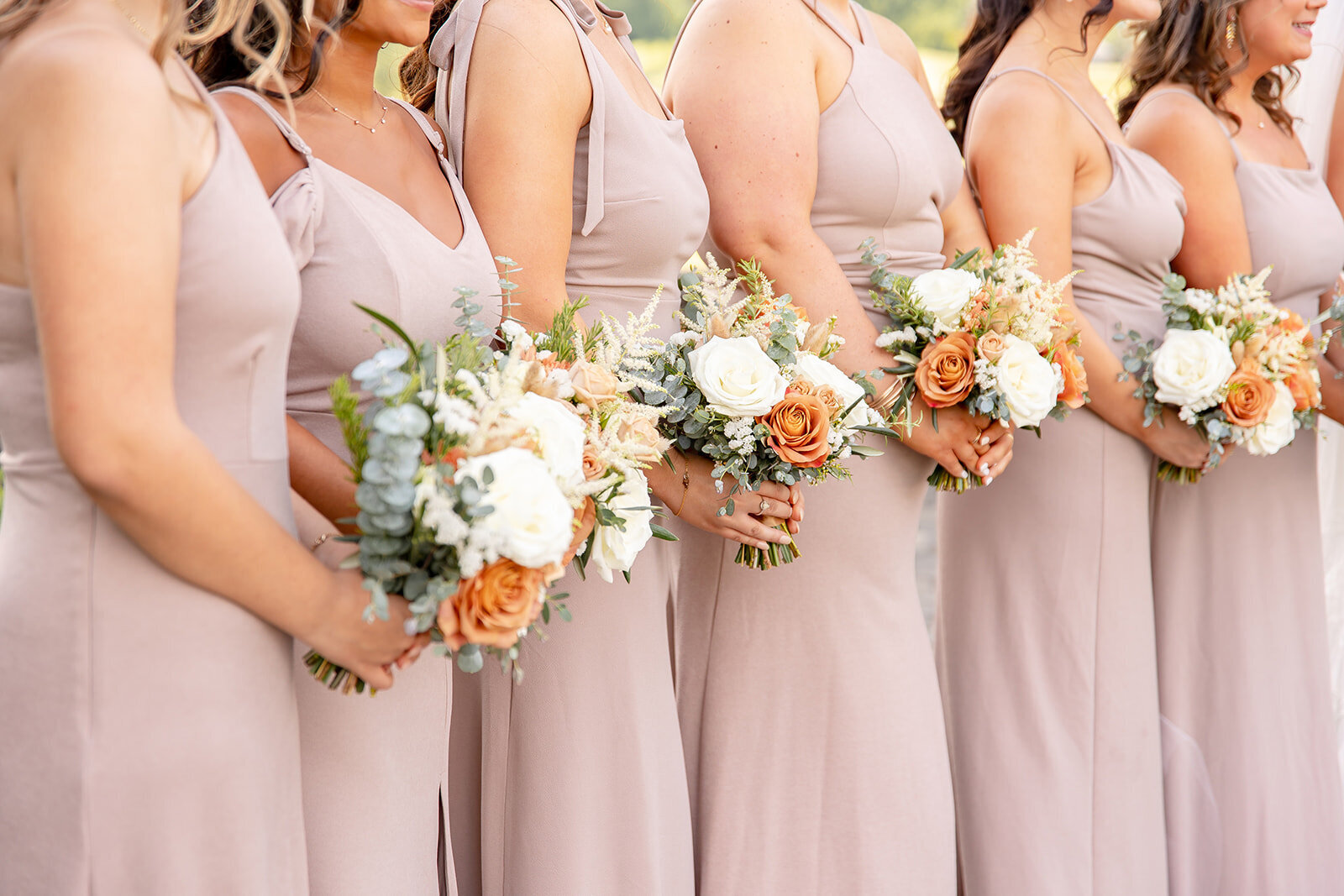 close up on bridesmaids bouquets