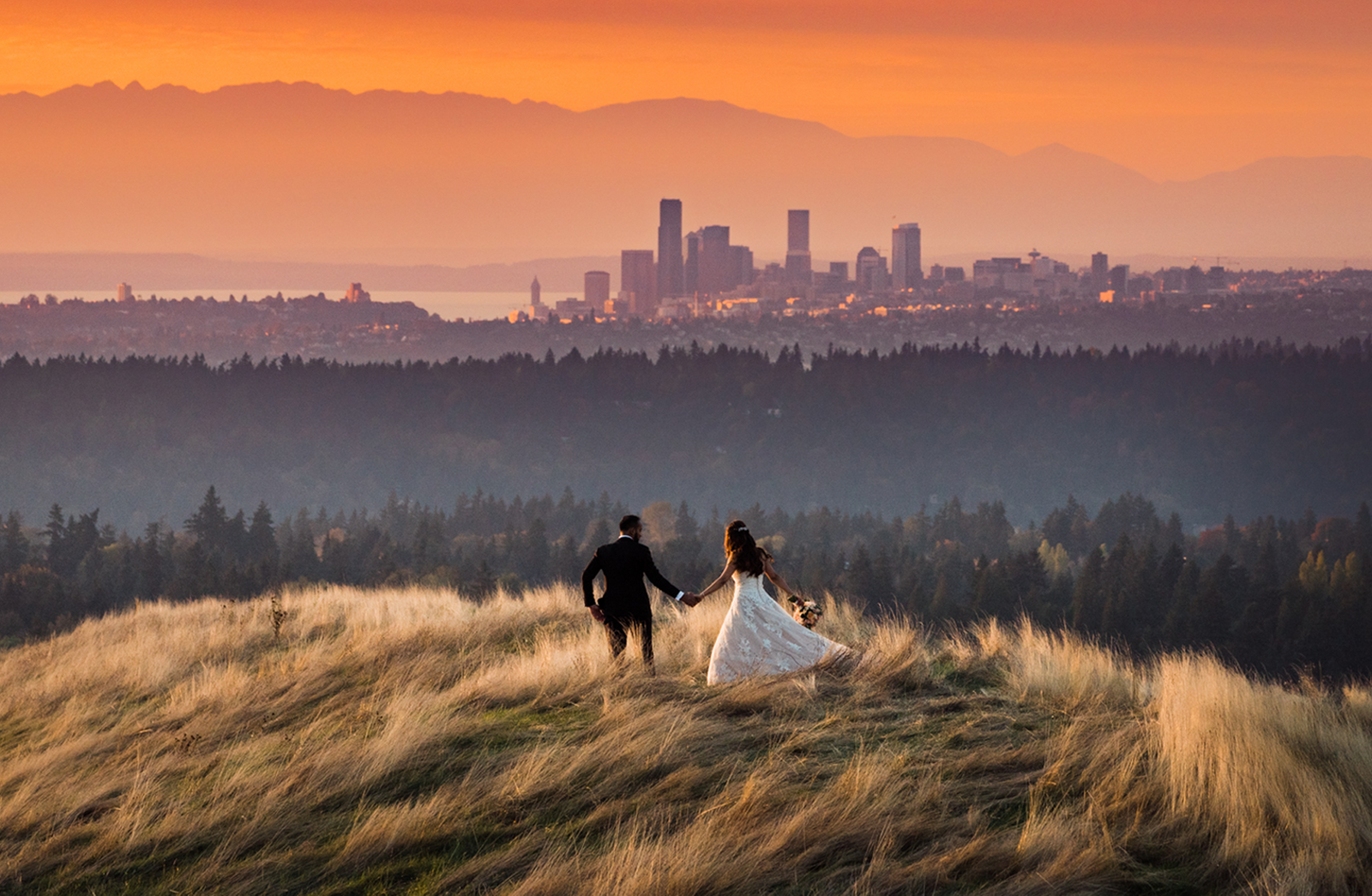 seattle wedding photography showcases husband and wife overlooking skyline