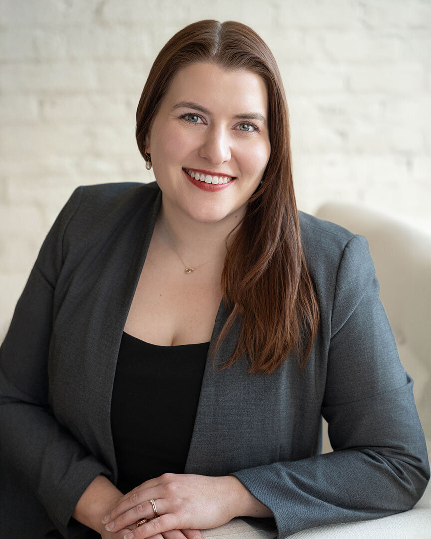 woman-in-grey-suit-smiling