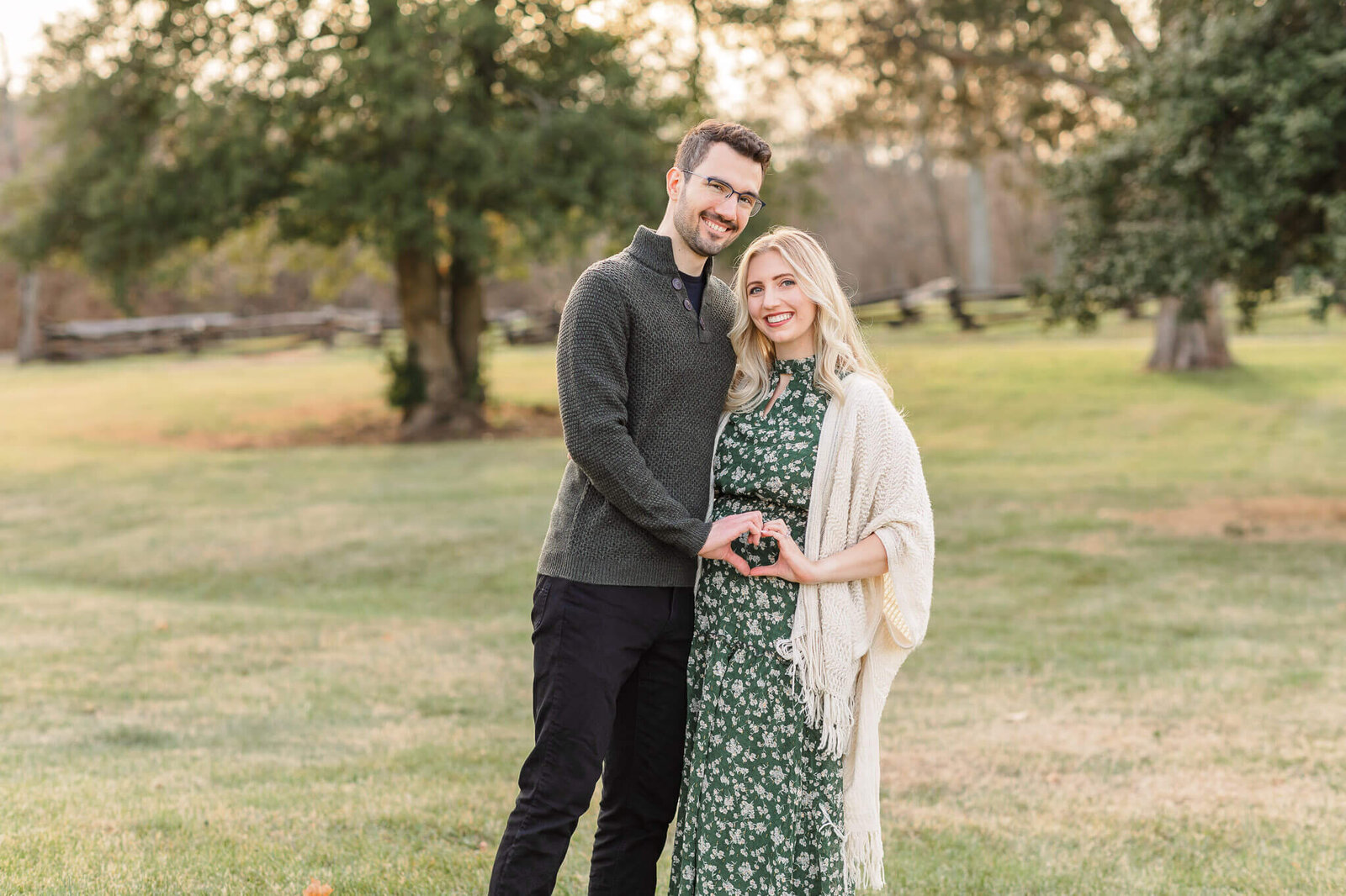 A mom and dad celebrating their pregnancy at Sully Historic Site.