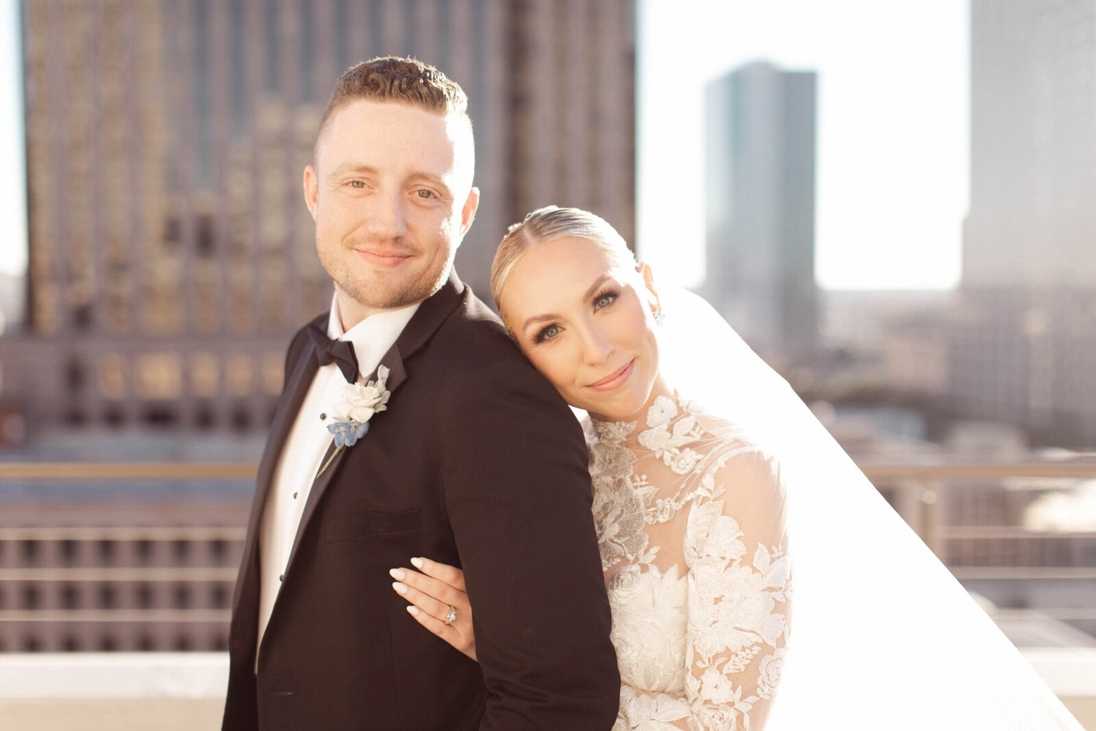 bride and groom standing on rooftop at New Orleans wedding