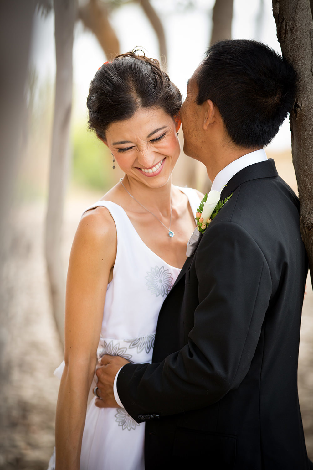 groom kissing bride