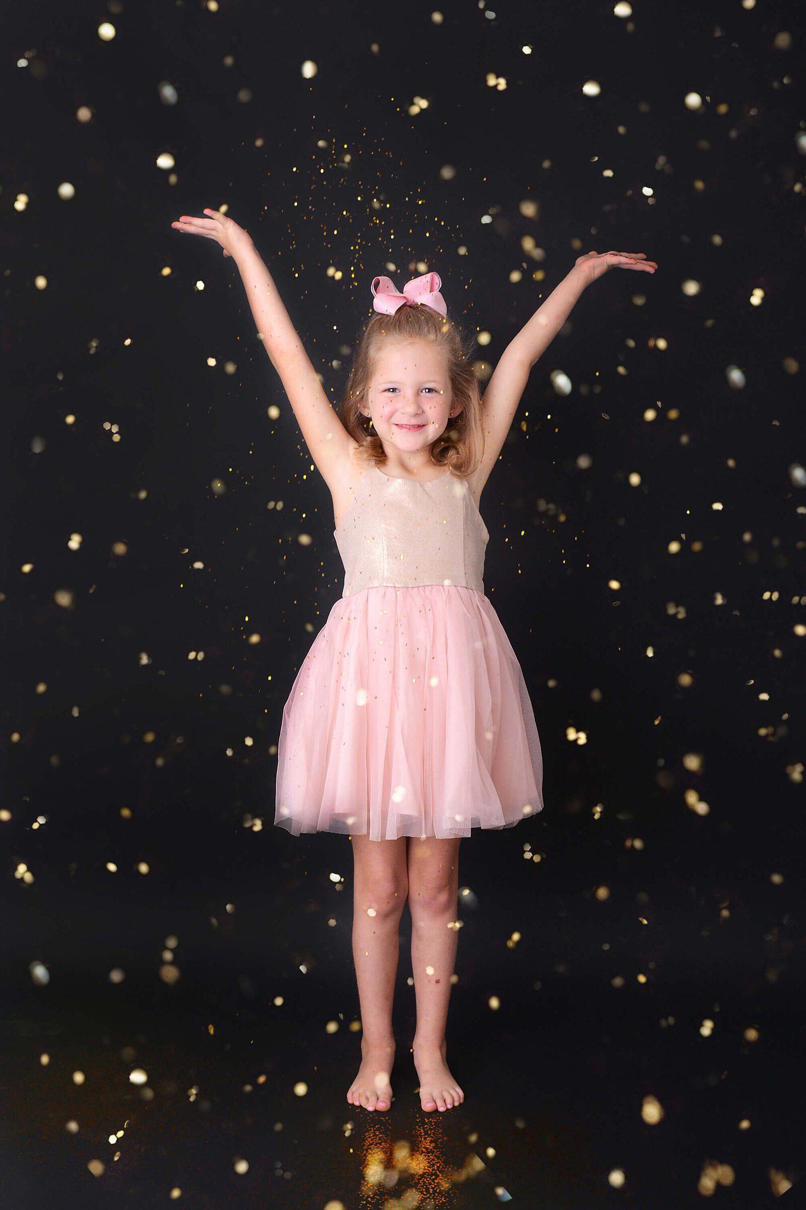 girl hands her hands in the air her glitter photoshoot