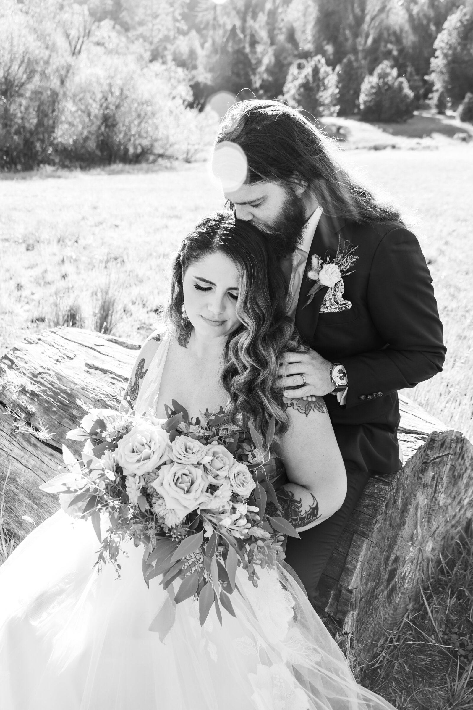 Tattoo bride and groom embrace on their colorful wedding day in Santa Cruz, California.