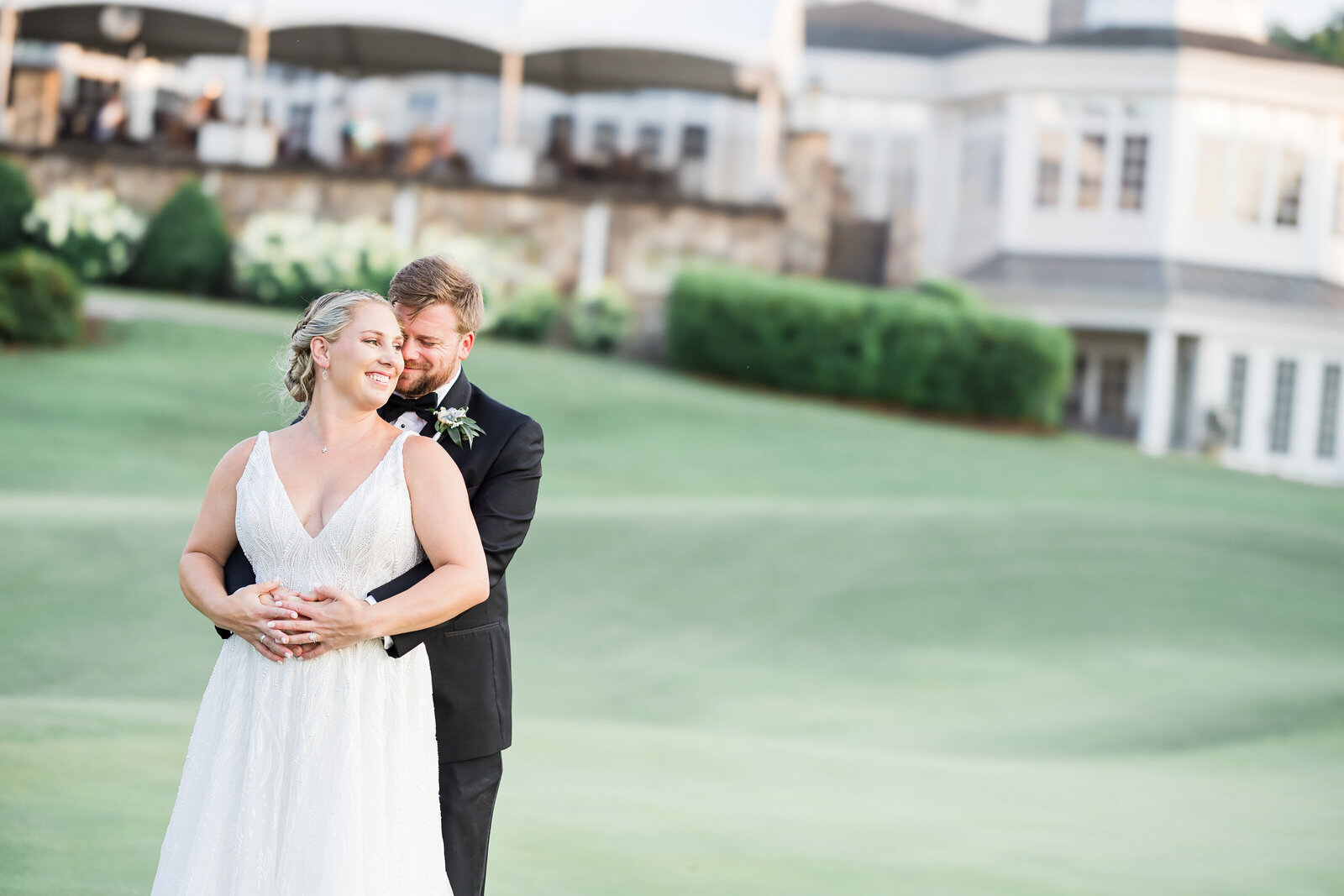 Bride and groom portrait at golf course
