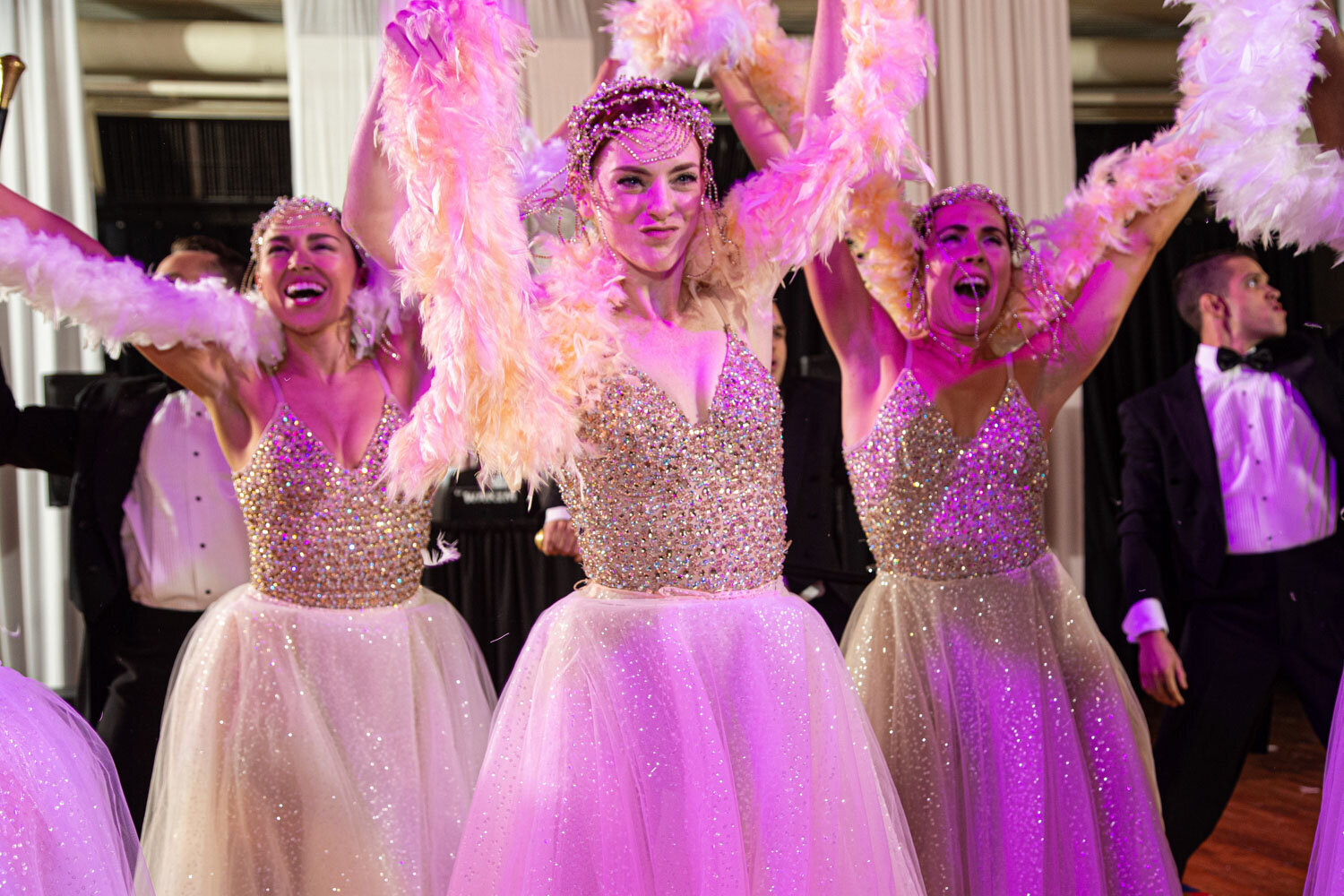 three people in there gown performing