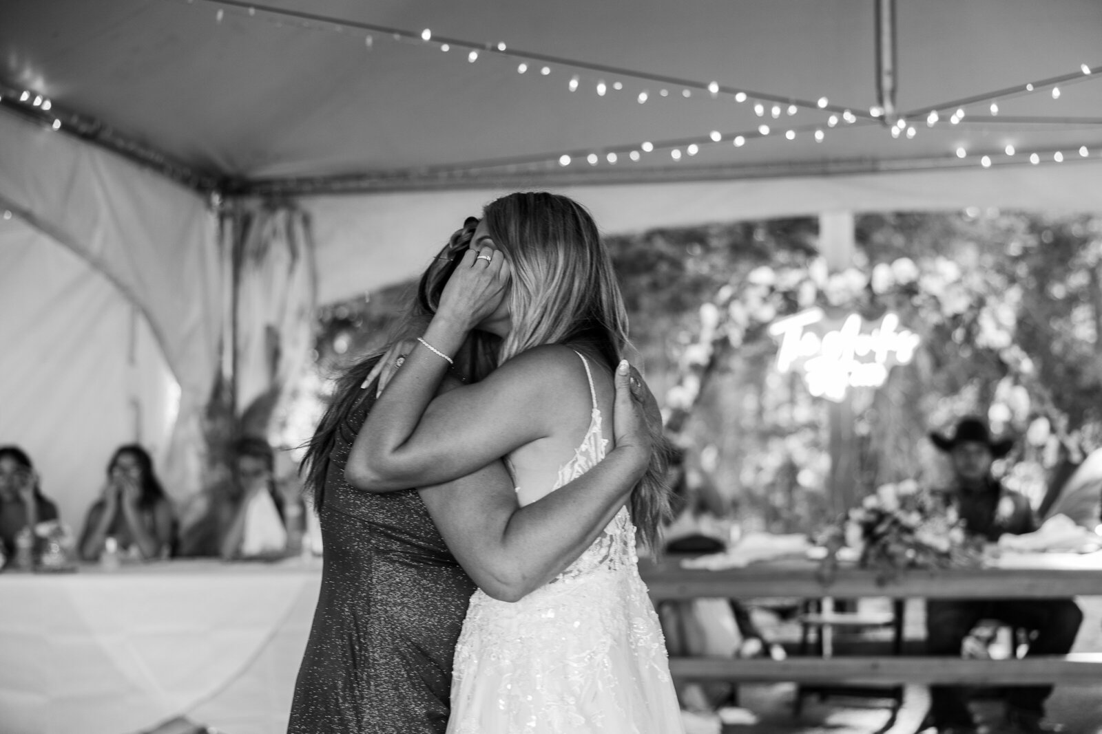 Mom and bride share emotional moment together as they dance at her wedding