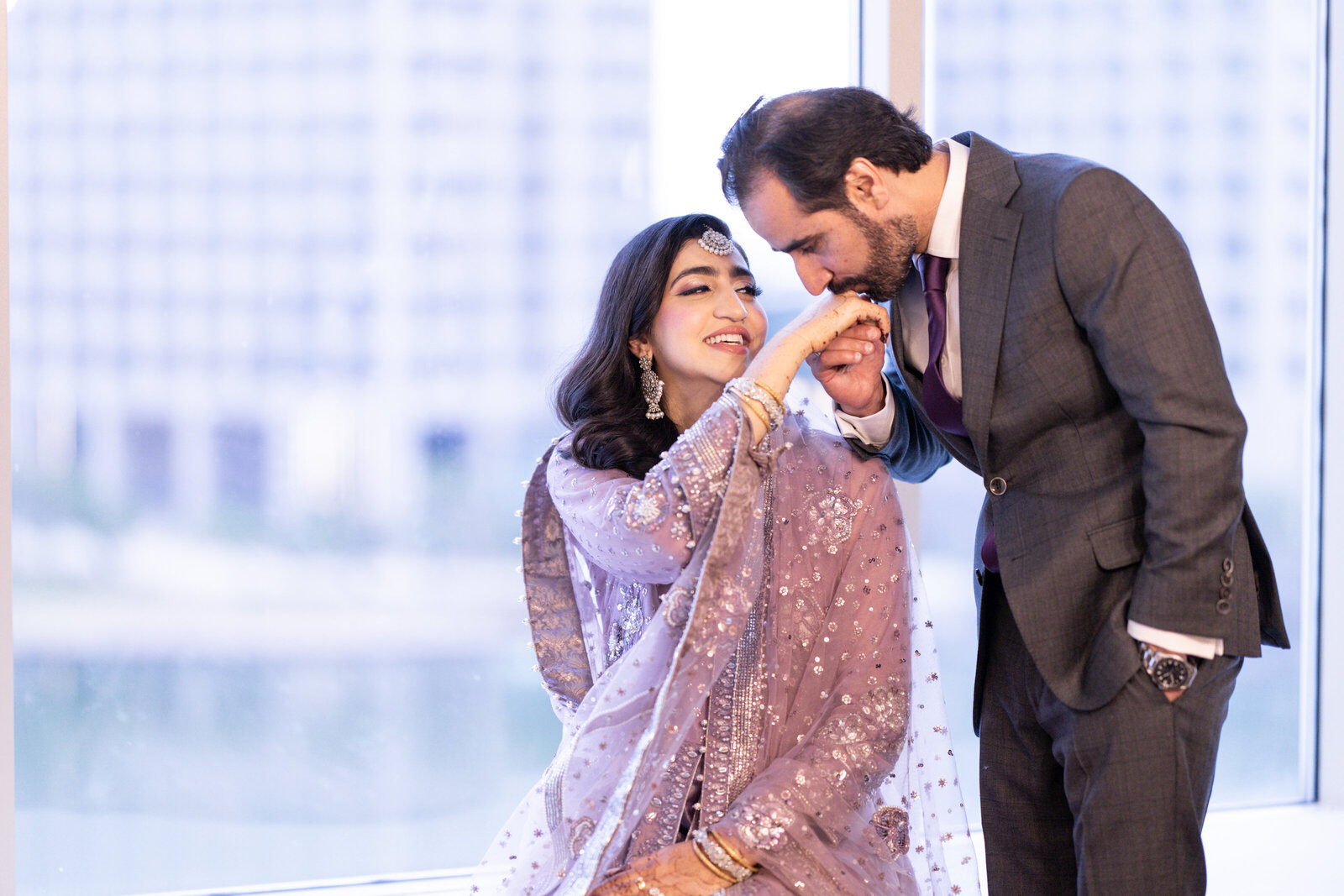 Groom-kissing-bride-hand-pose-ideas