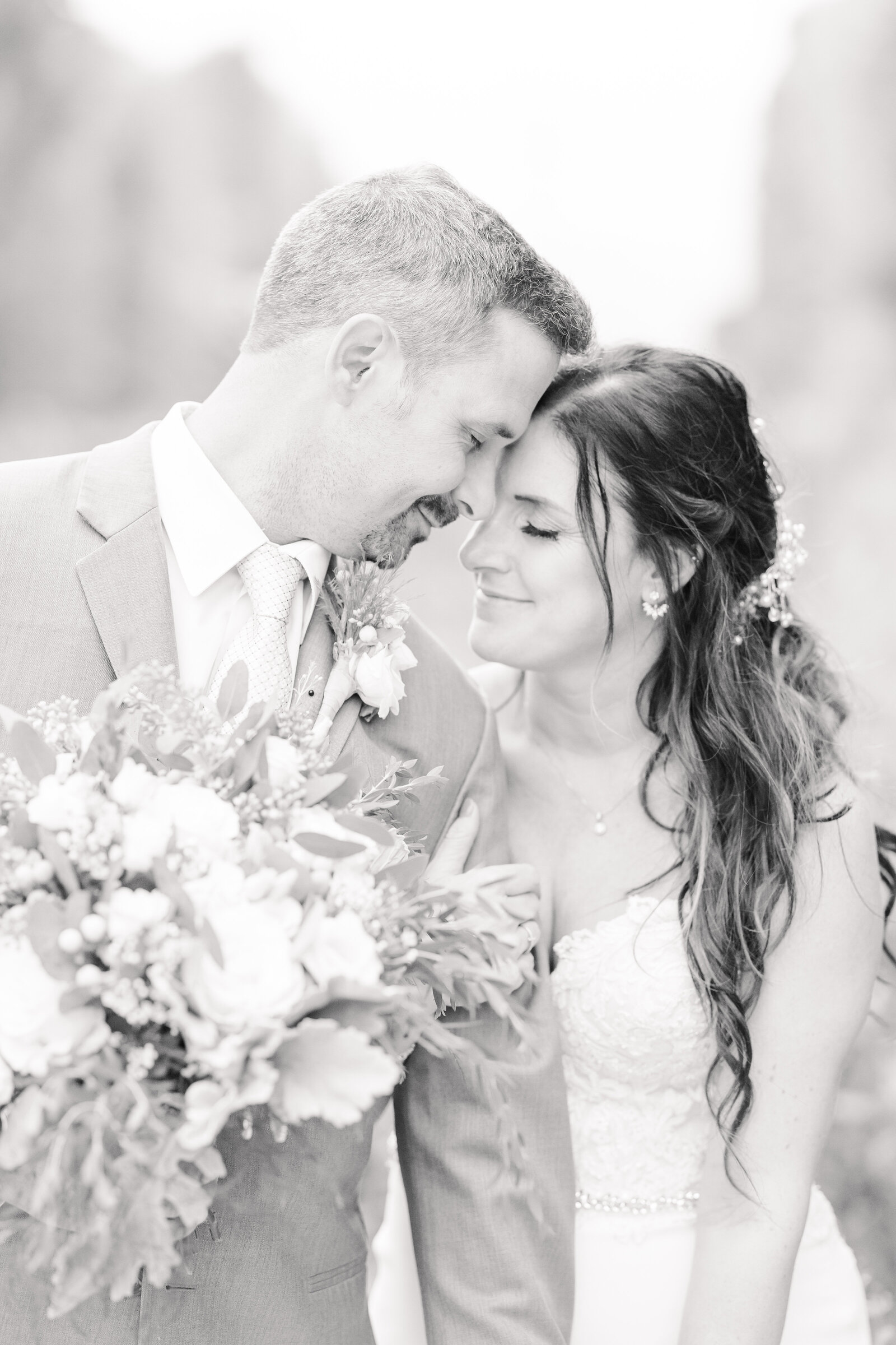 bright light and airy wedding photo of bride  and groom